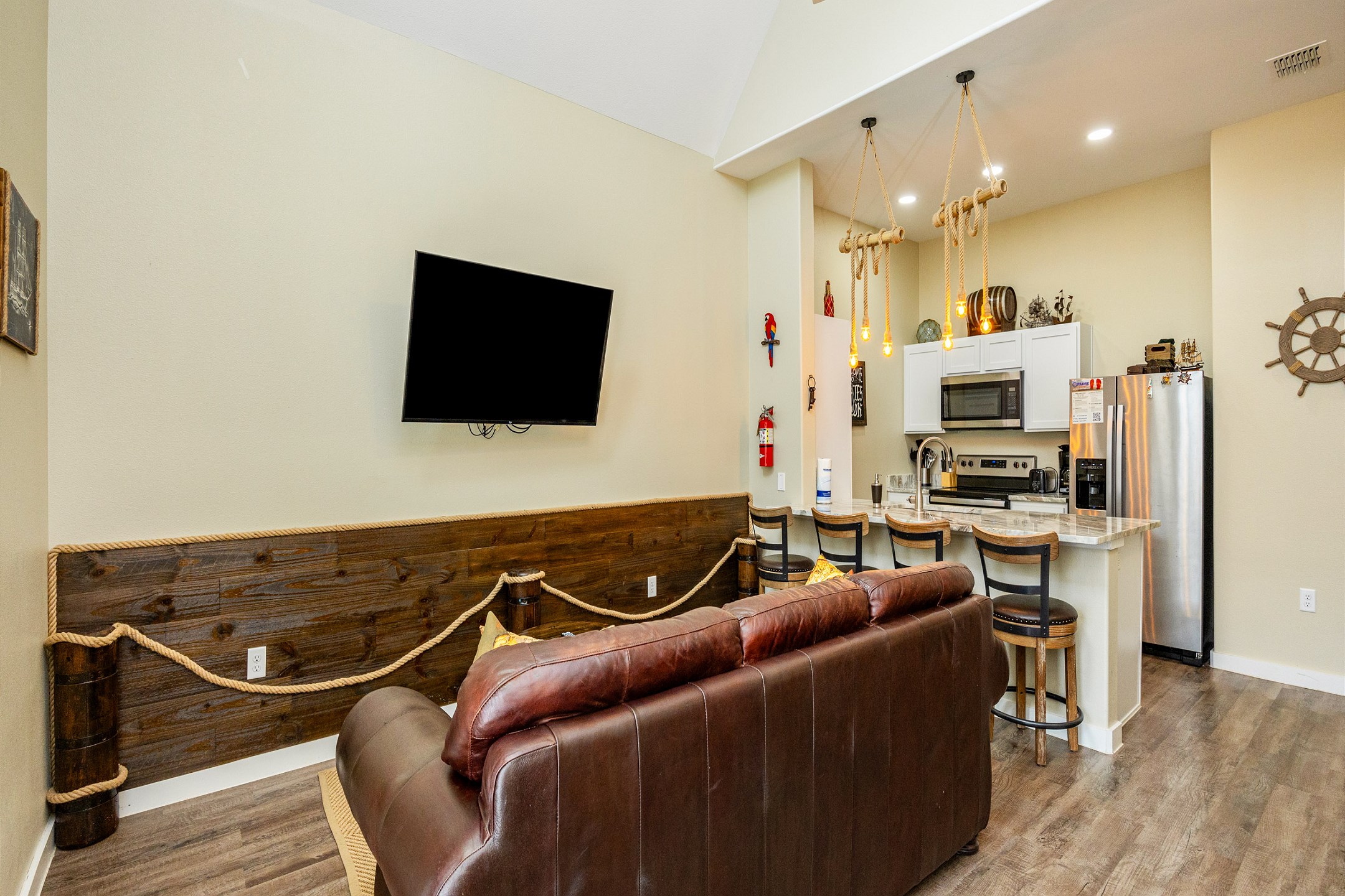Open-concept living area with high ceilings, flooded with natural light and providing the perfect ambiance for unwinding after a day of adventures