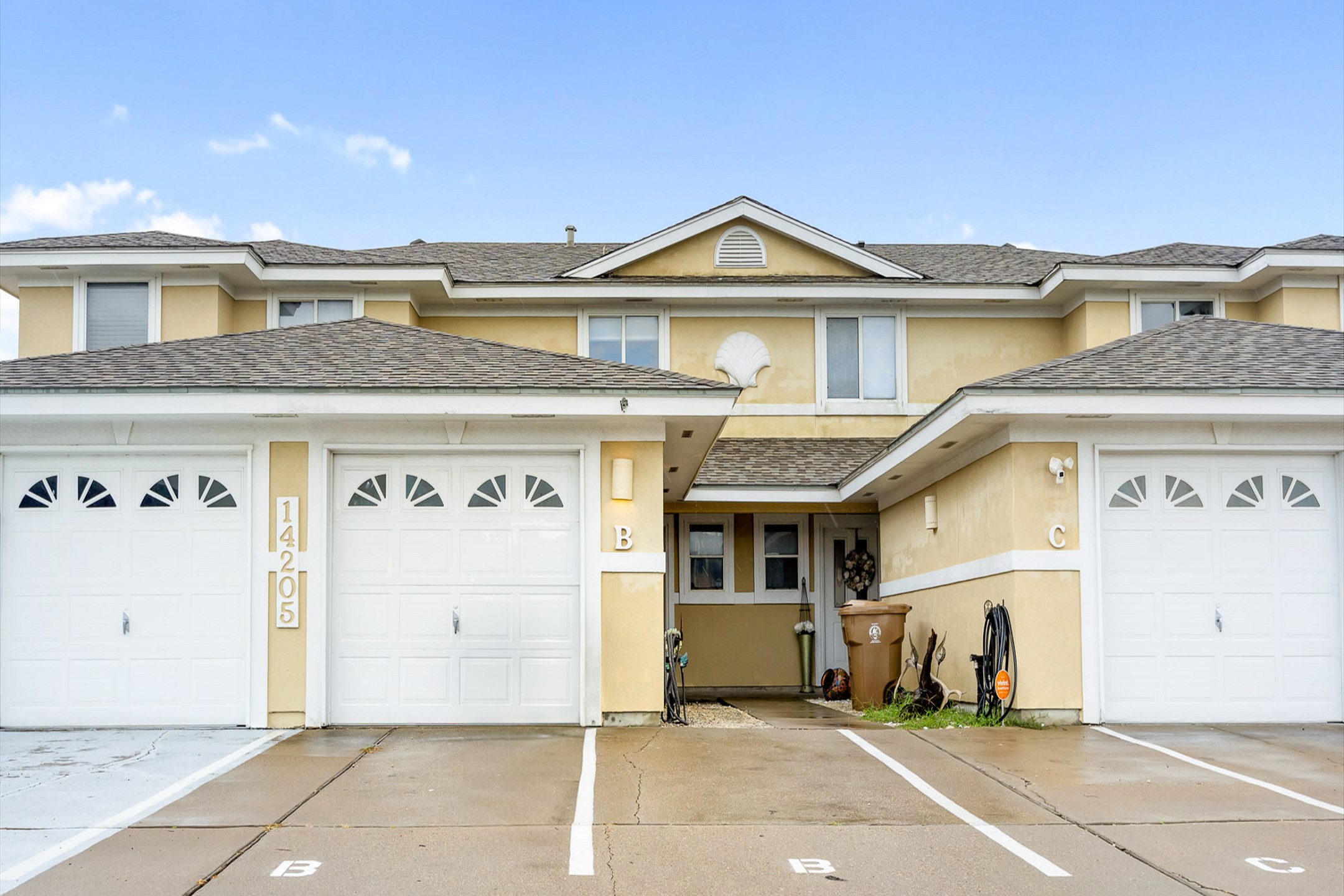Front exterior of the property with designated boat / trailer parking available in assigned spots within the complex (no garage access)