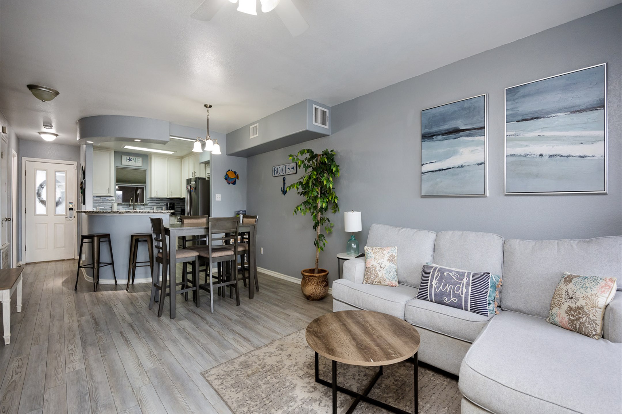 Luxurious open-concept living space featuring contemporary furnishings and bathed in natural light