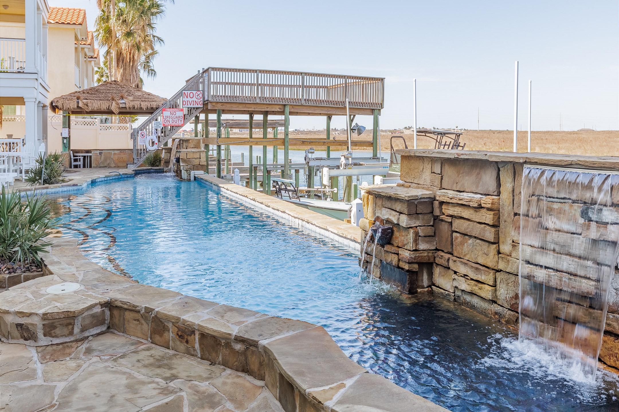 Waterfalls in pool create a beautiful scene 