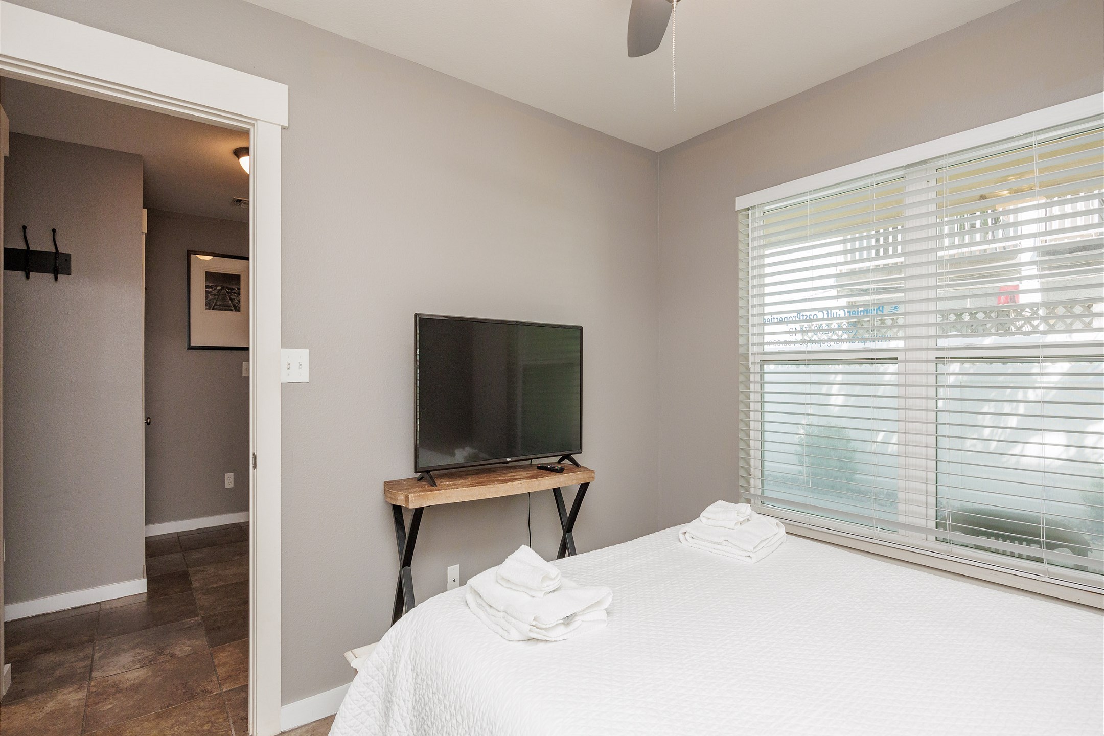 Third floor bedroom with queen size bed and TV
