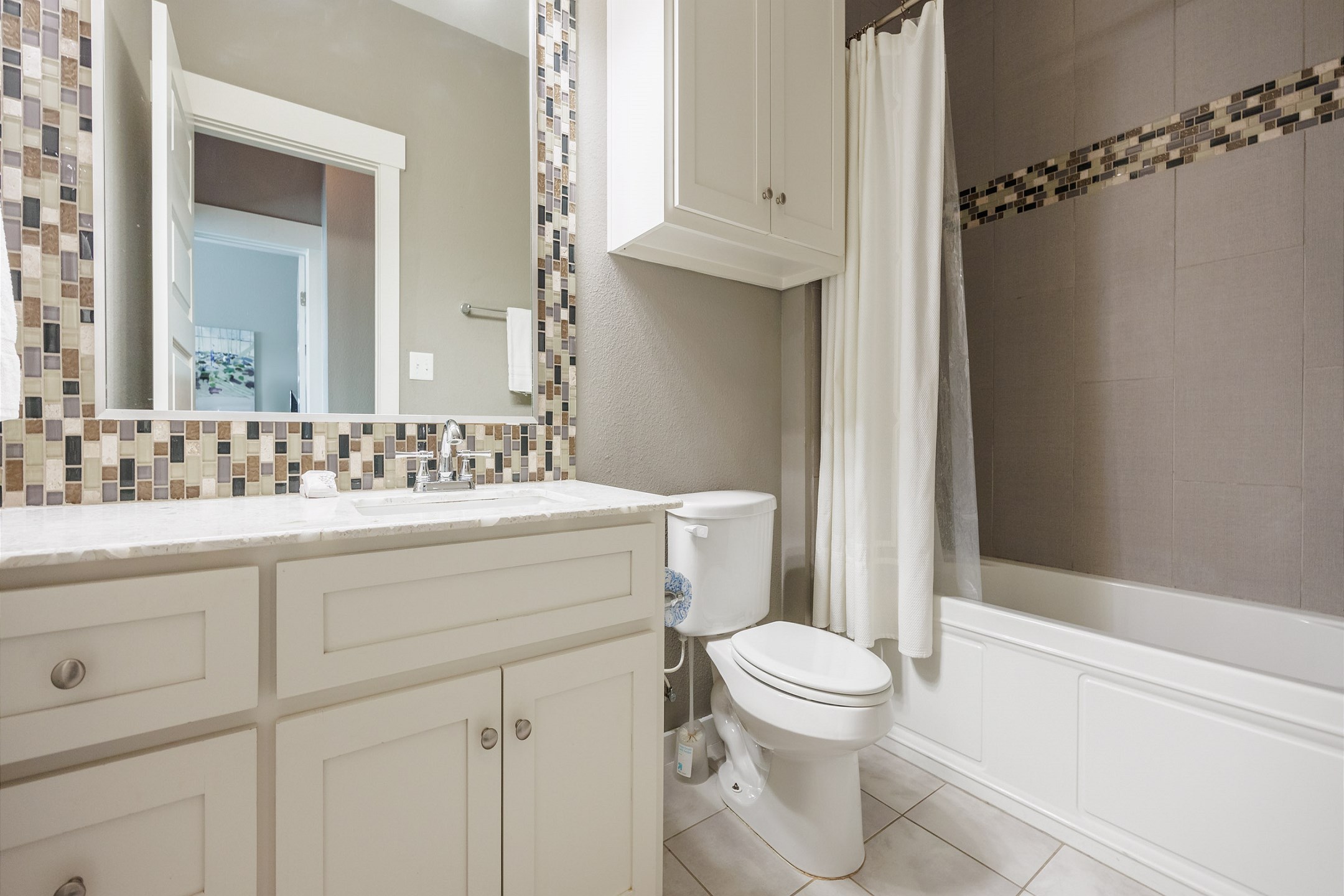 Third floor bathroom with single sink, shower, and tub/shower combo 