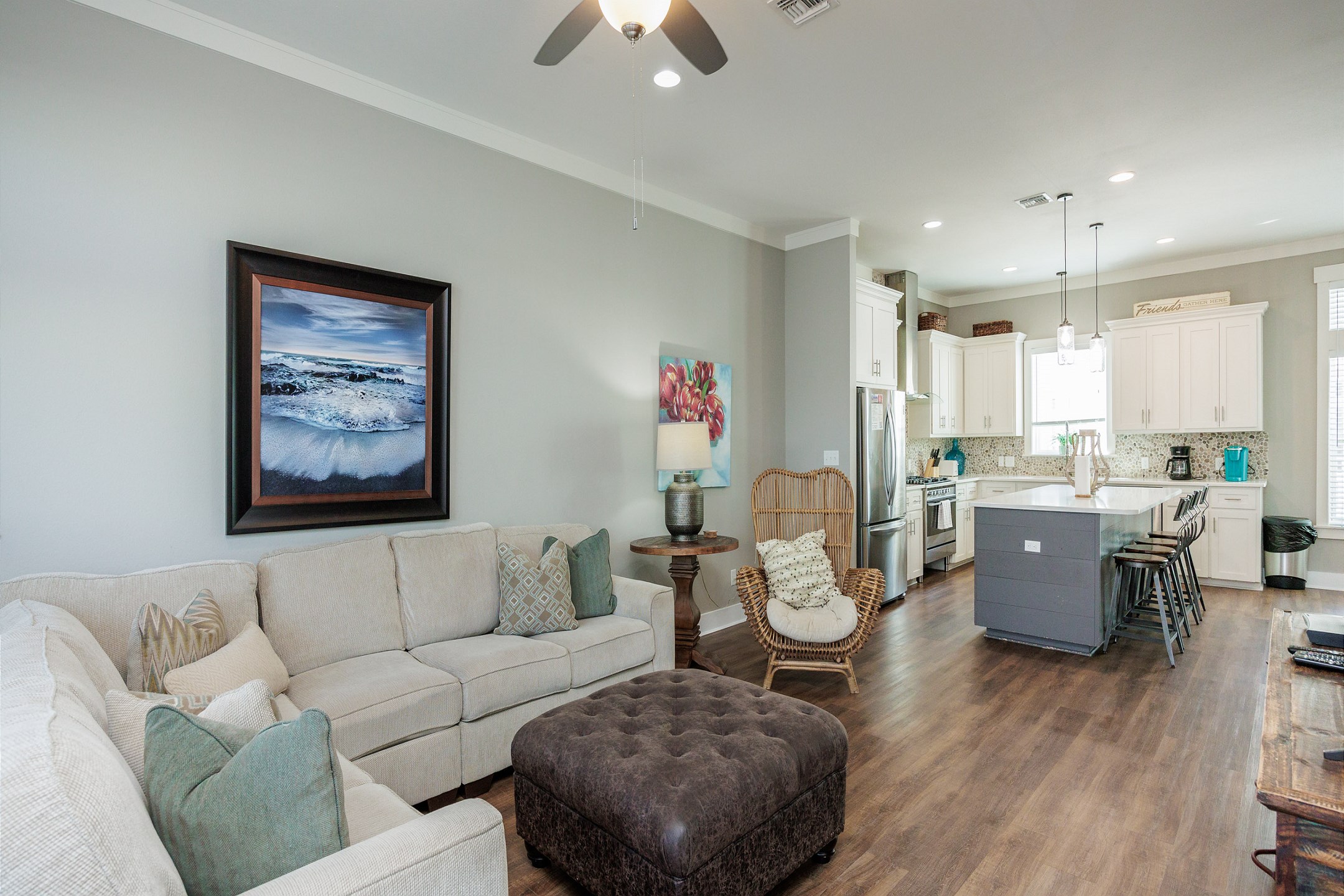 Living area with large sofa and flat screen TV located on second floor 