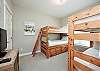 Third floor bedroom with twin over twin size bunk beds and flat screen TV