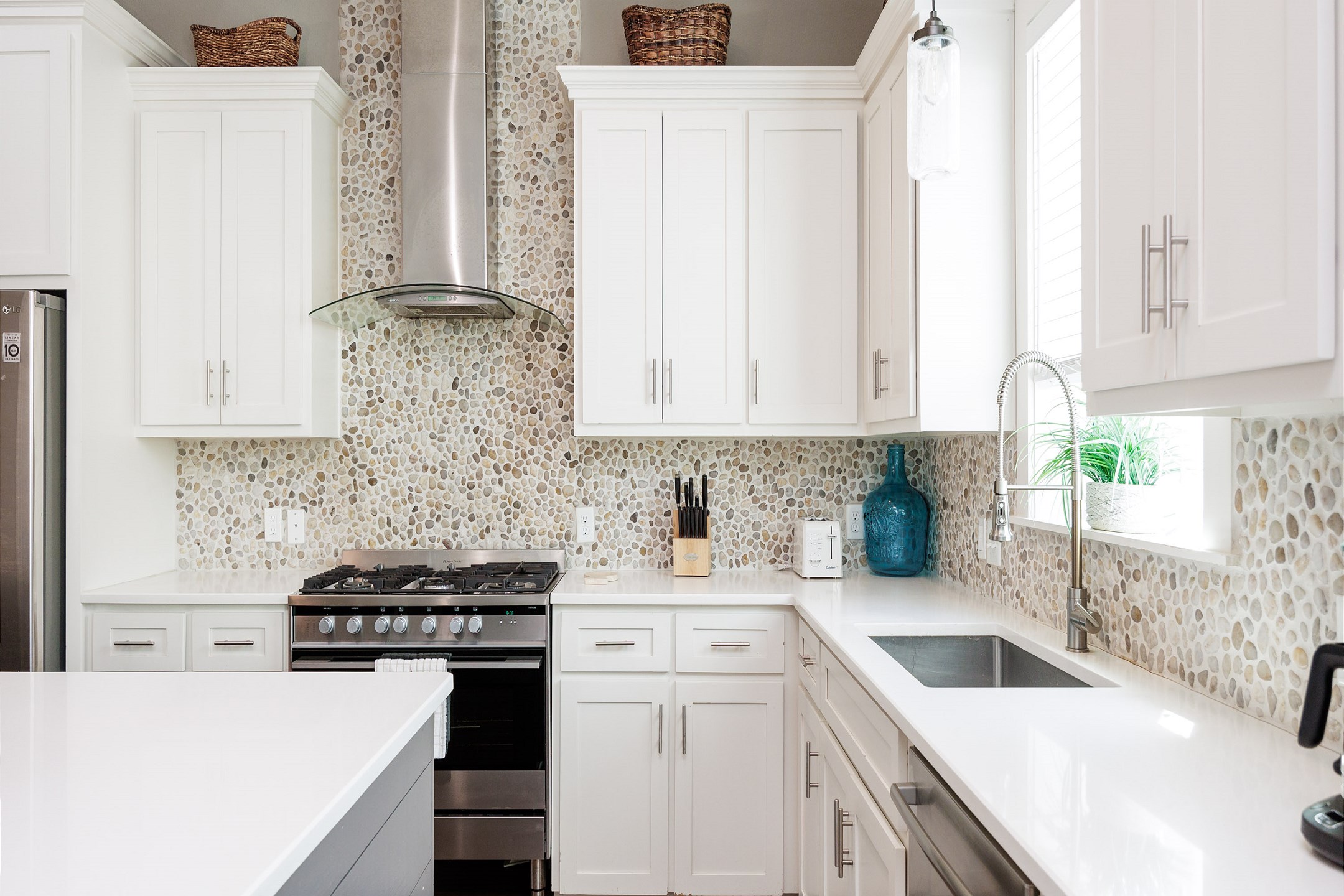 Kitchen with plenty of counter space and stainless steel appliances 