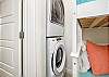 Washer and dryer in hallway nook for guest convenience