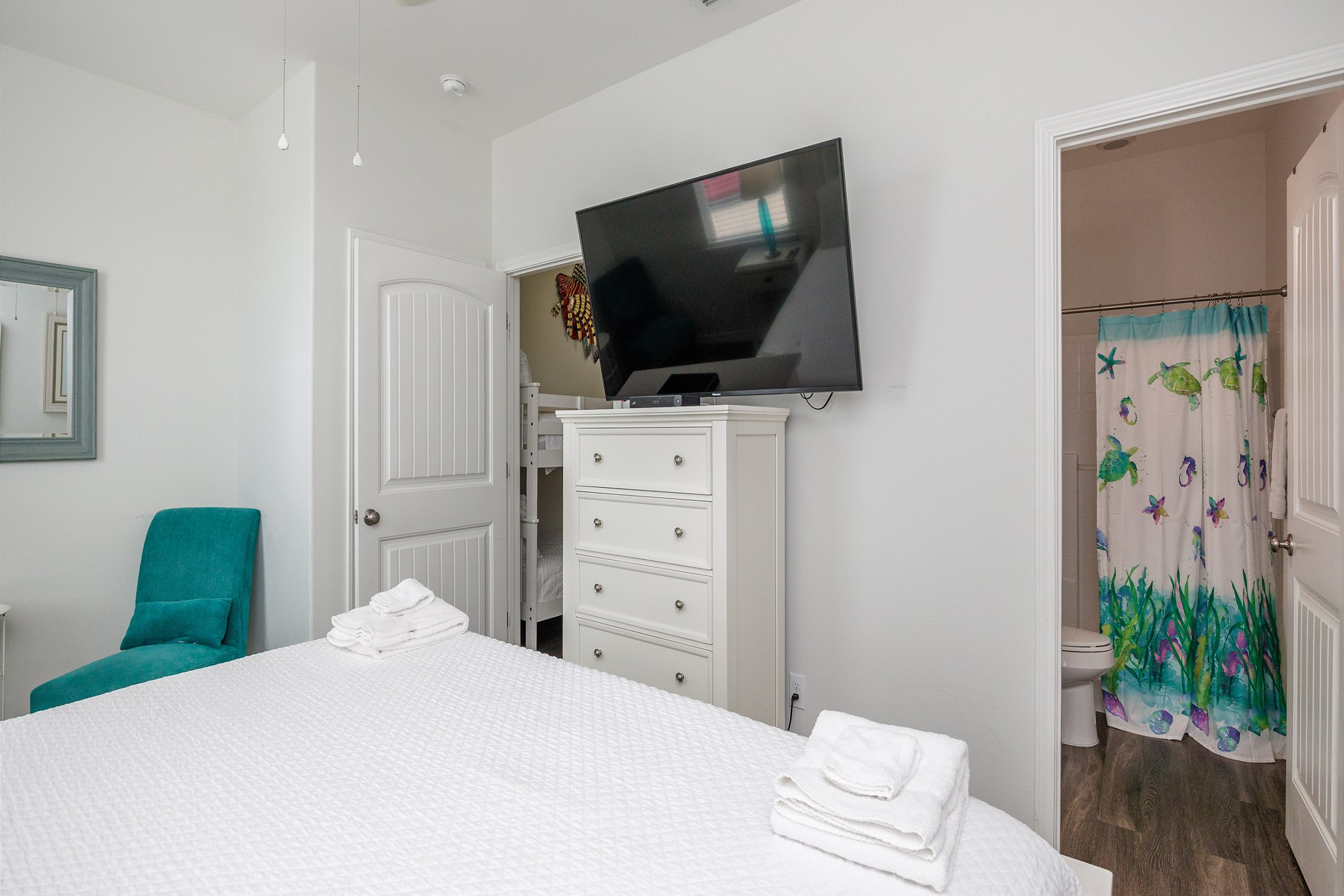 Second bedroom on the second floor with king size bed, private bathroom and flat screen TV 