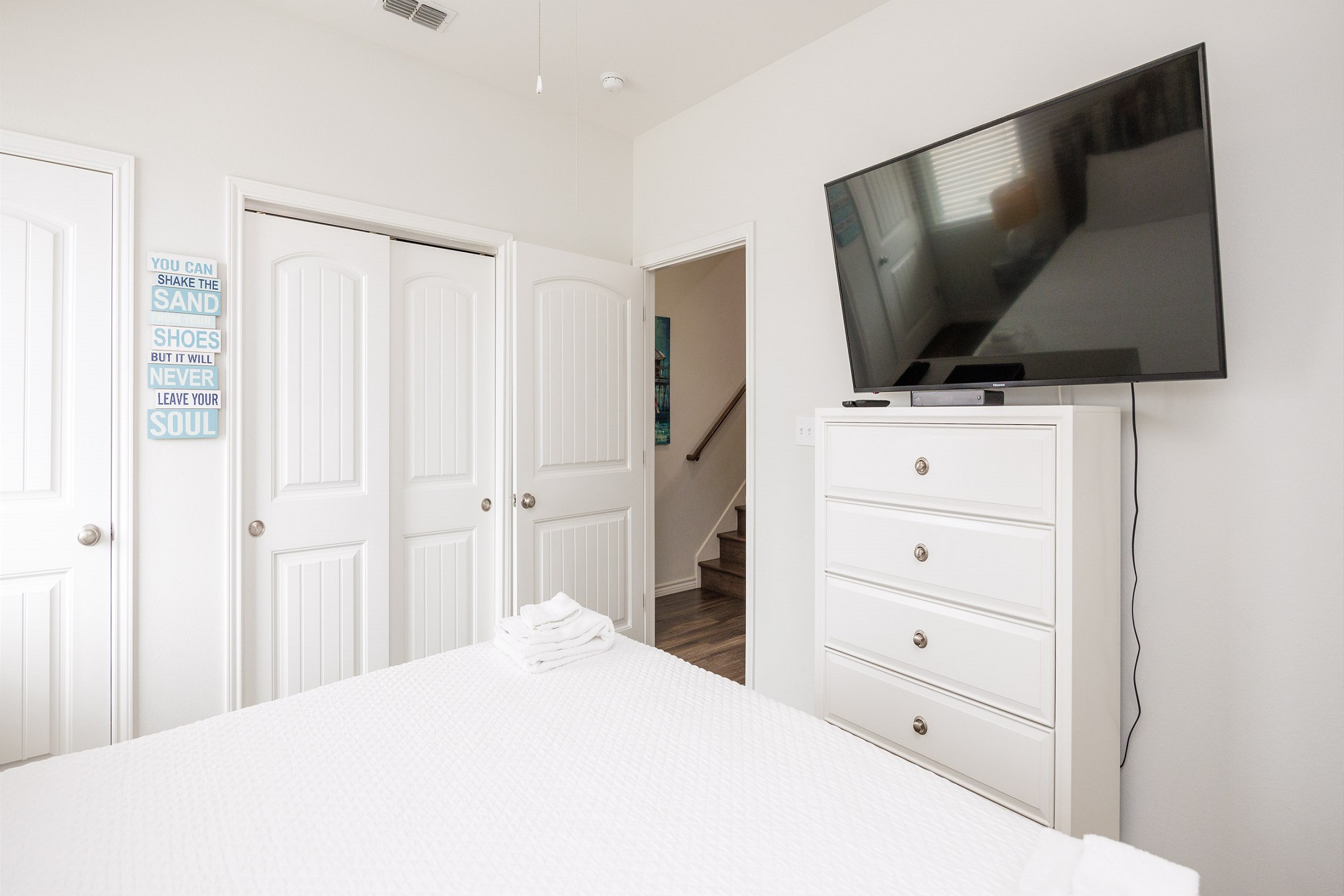 Master bedroom on the first floor with king size bed and flat screen TV