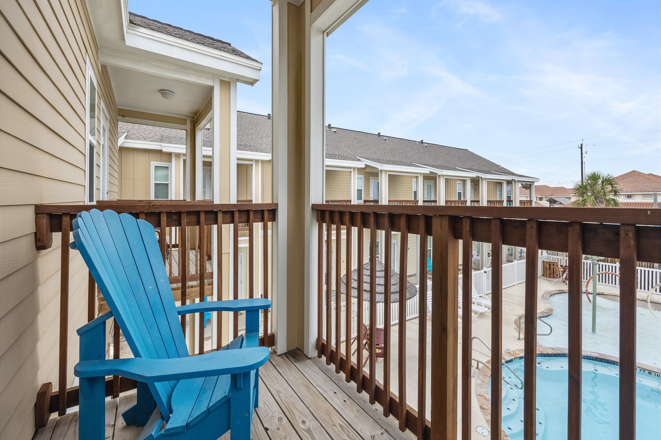Private balcony attached to third bedroom with a pool view