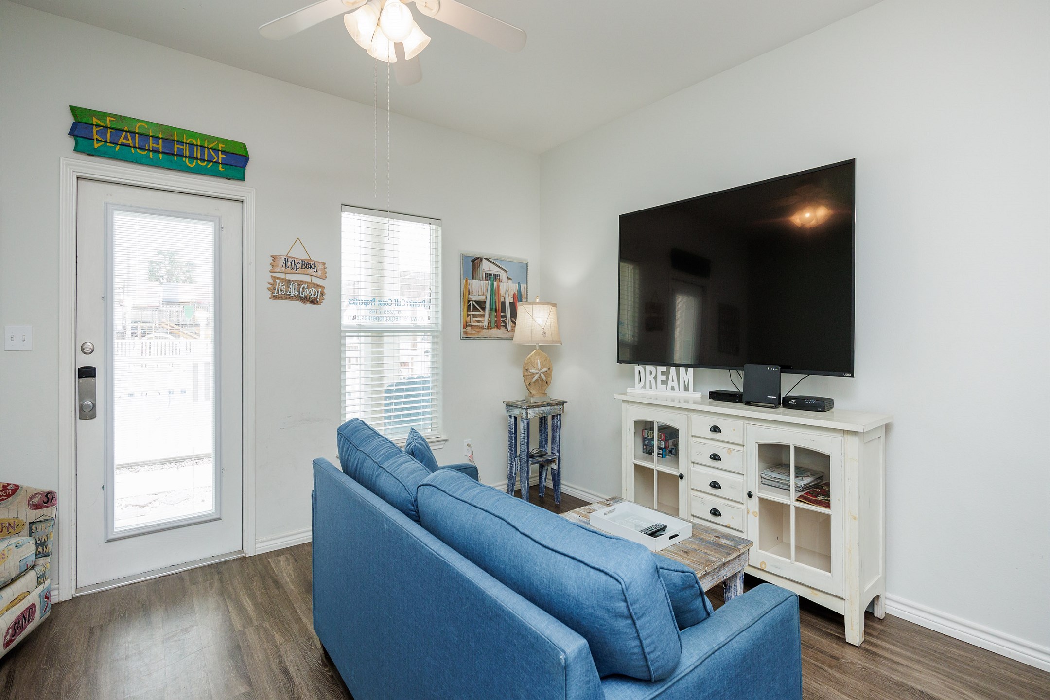 Living area with queen size sleeper sofa, twin daybed with twin trundle, and flat screen TV