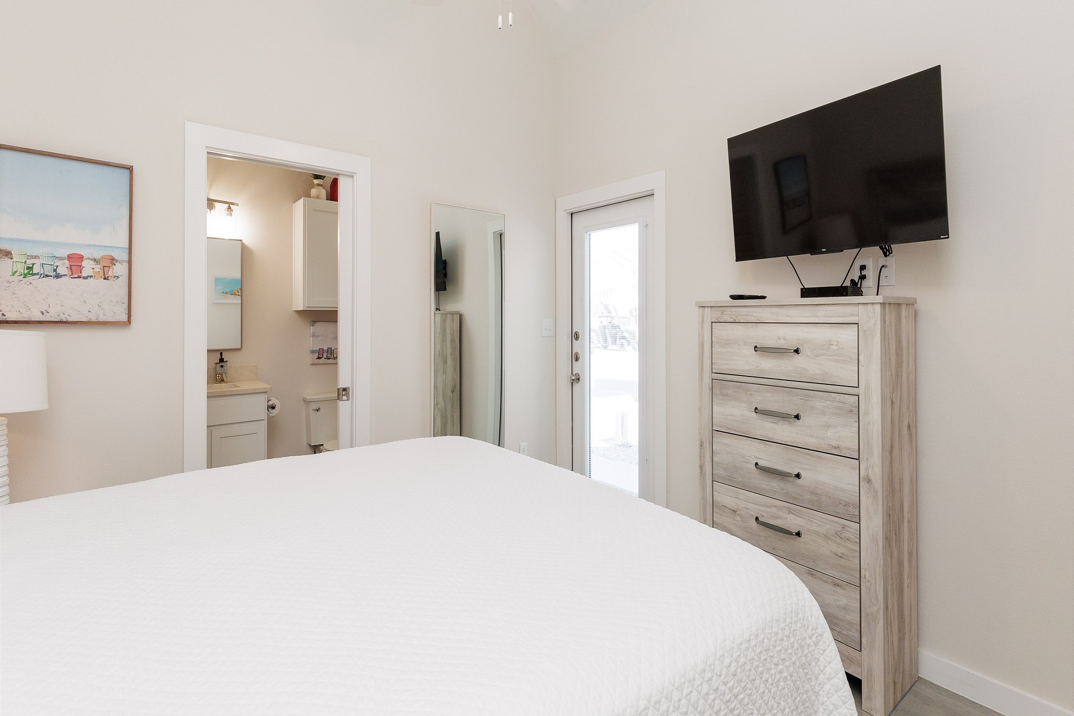 Master bedroom with king size bed, private bathroom and flat screen TV 