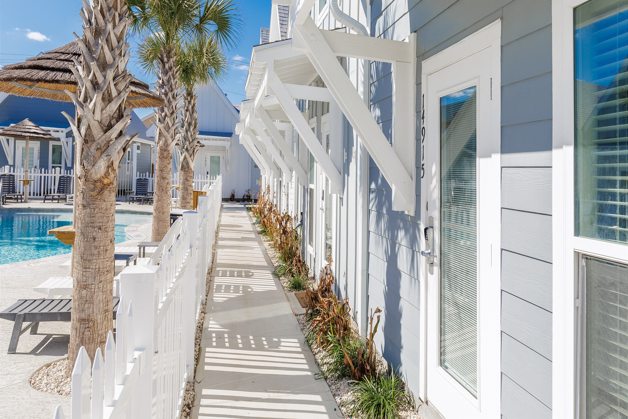 Front walkway opening up to pool / playground area 