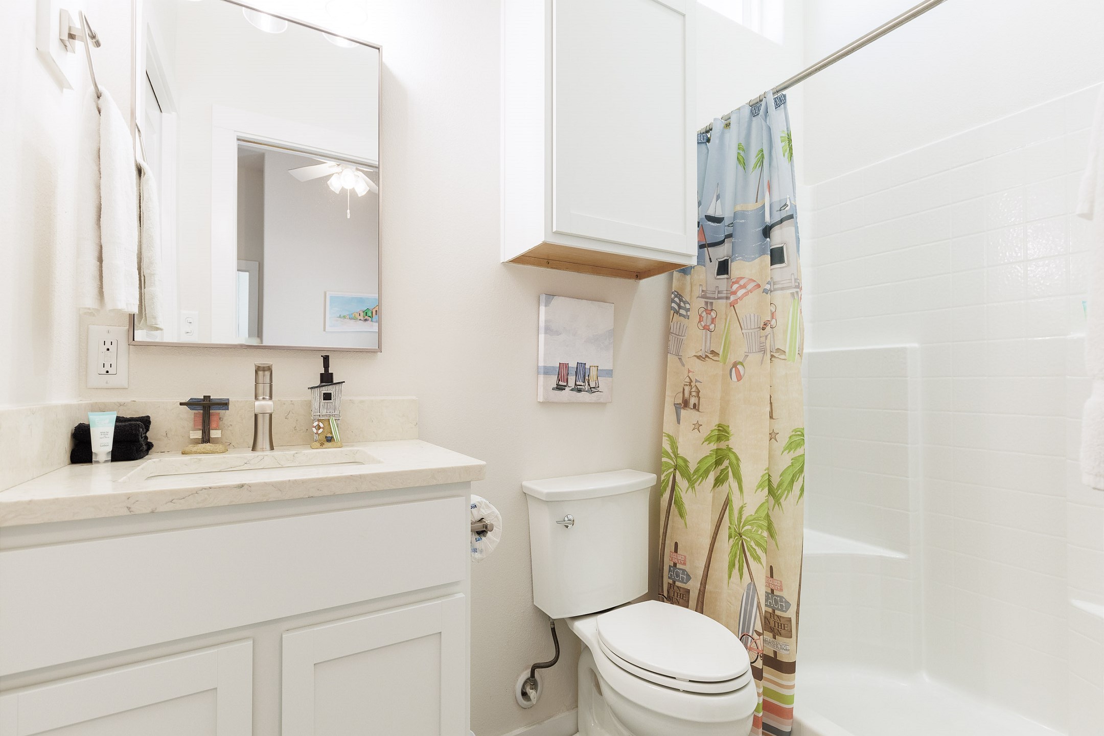 Master bathroom with single sink, toilet, and walk-in shower 