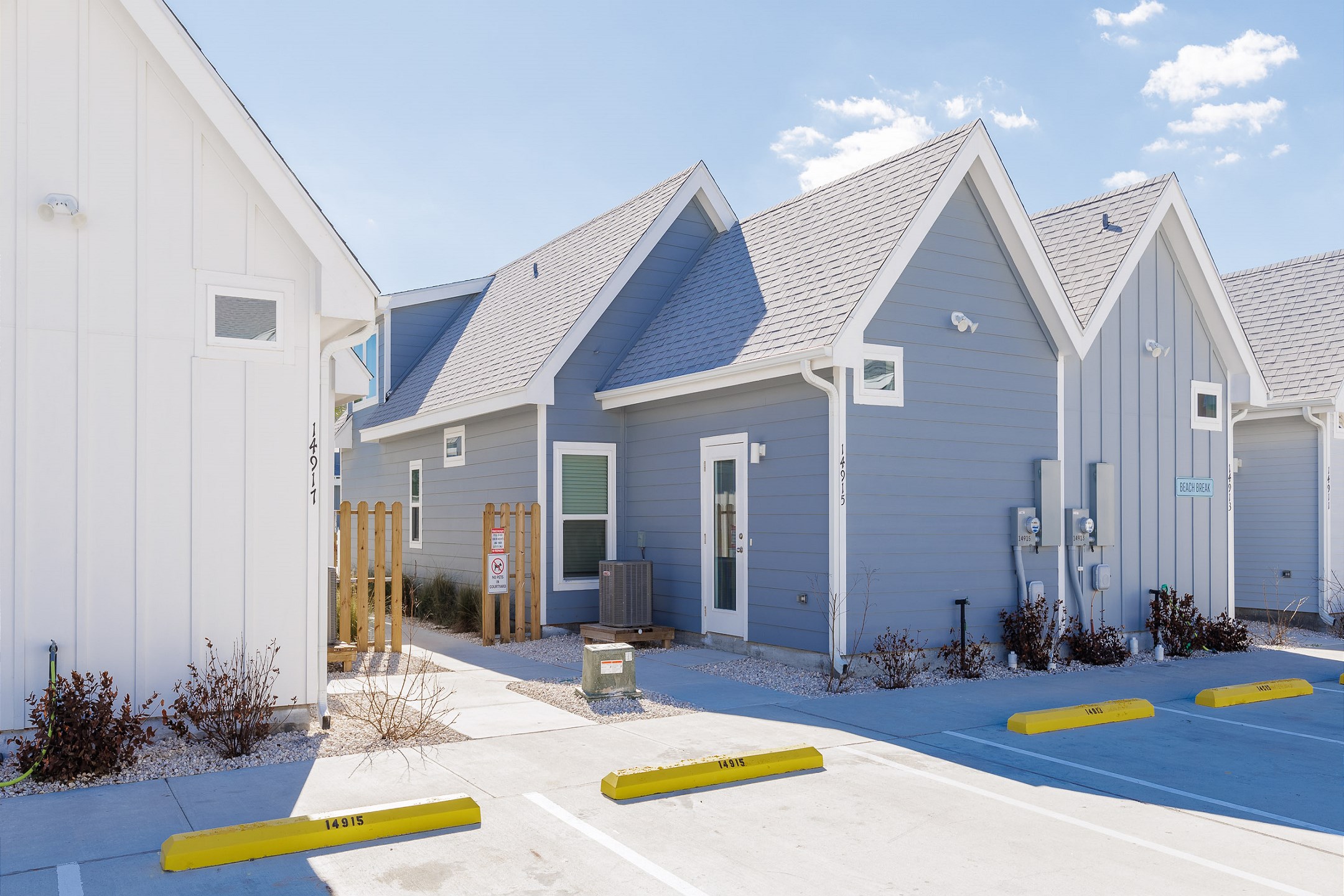 Exterior of property with two reserved parking spaces 