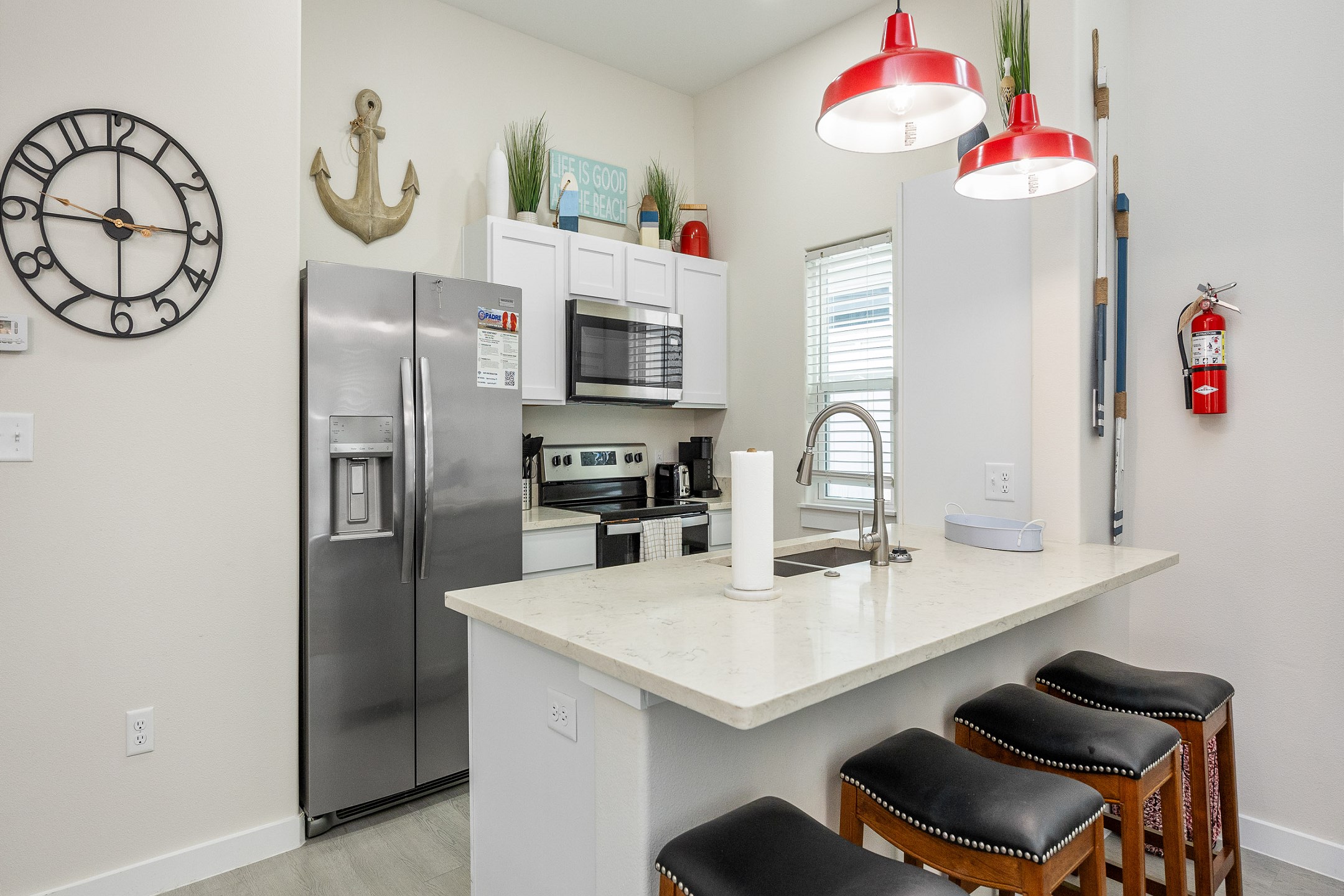 Modern kitchen with breakfast bar that seats four 