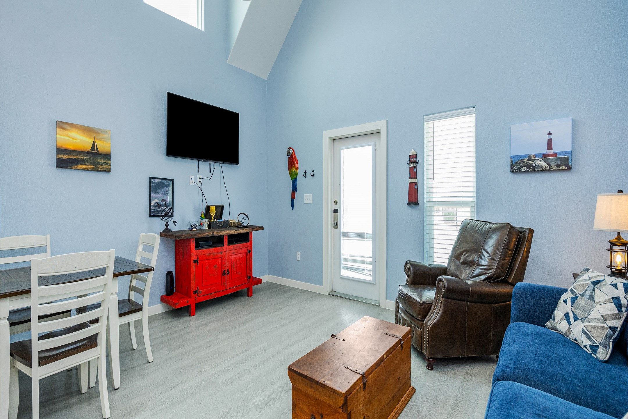 Open-concept living area with high ceilings, natural lighting and the perfect ambiance for unwinding after a day of adventures