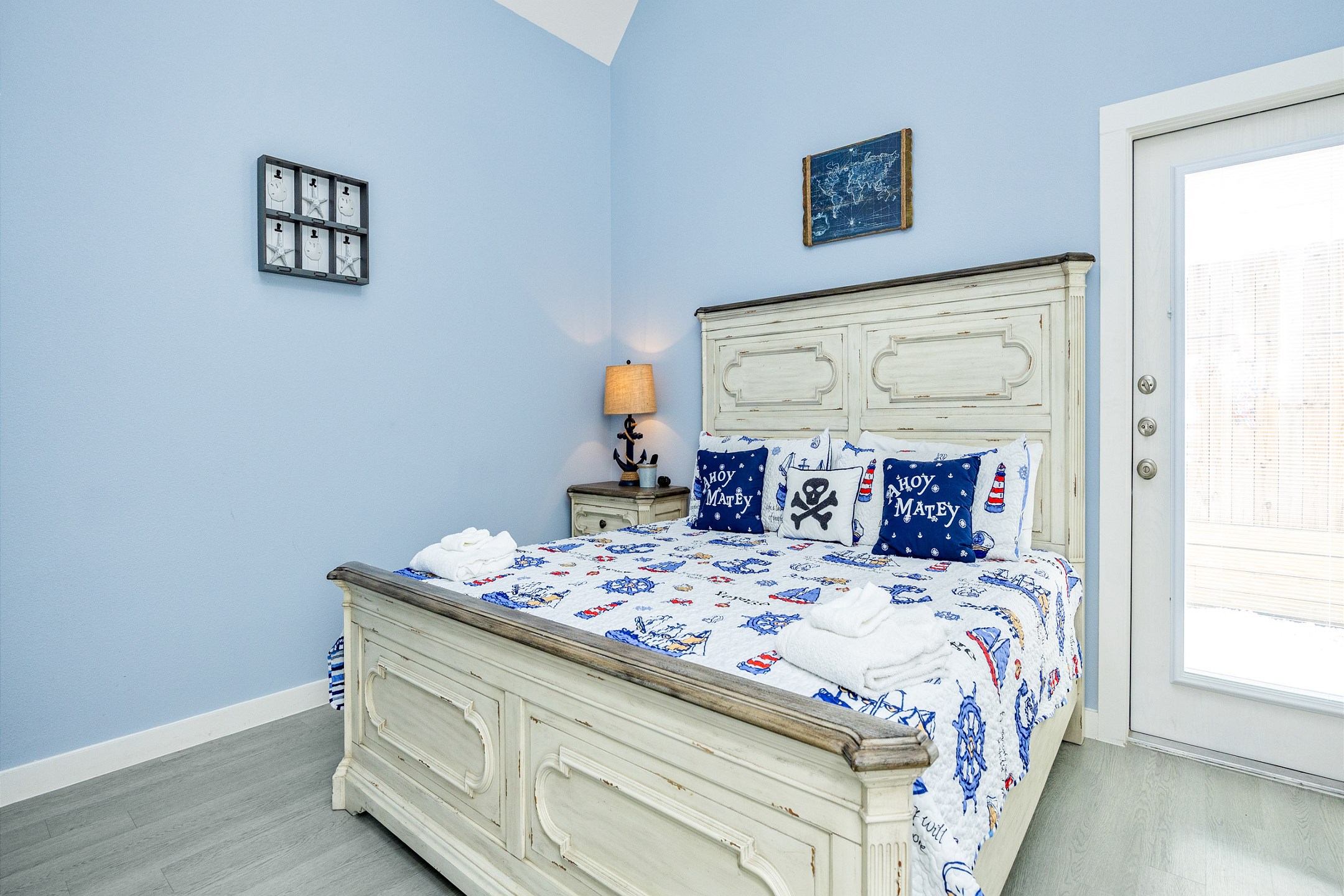 Master bedroom with king size bed, access to private patio, and a flat screen TV