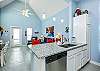 Kitchen area breakfast bar with Granite counter tops and bright lighting 