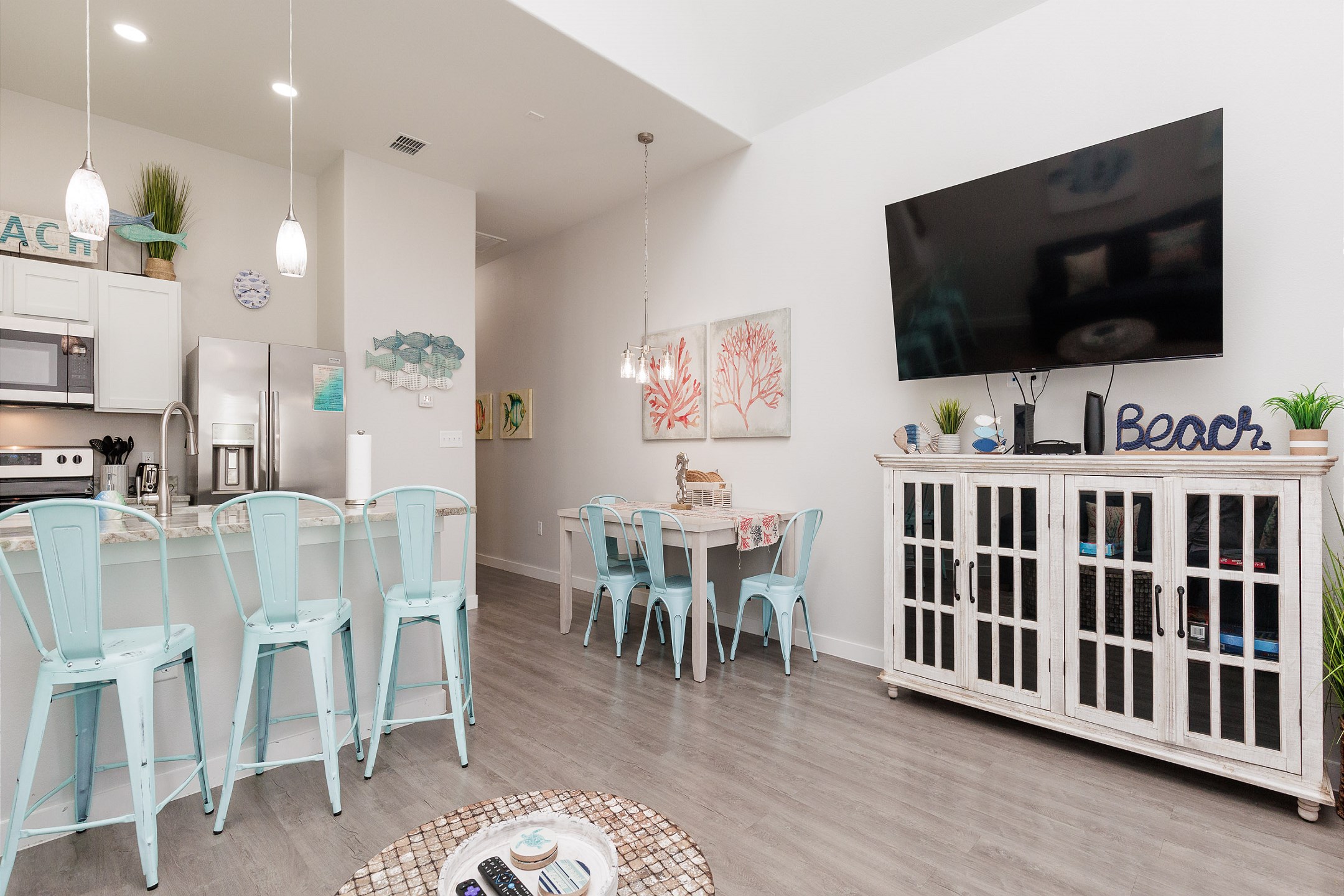 The kitchen, dining, and living areas blend together seamlessly for a bright and airy feel