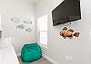 Second bedroom with twin over full bunk bed with twin trundle and fish themed decor 