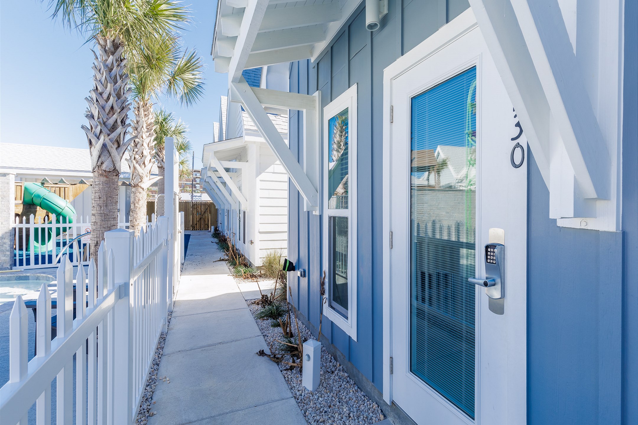 Front entryway opening up to playground / pool area 