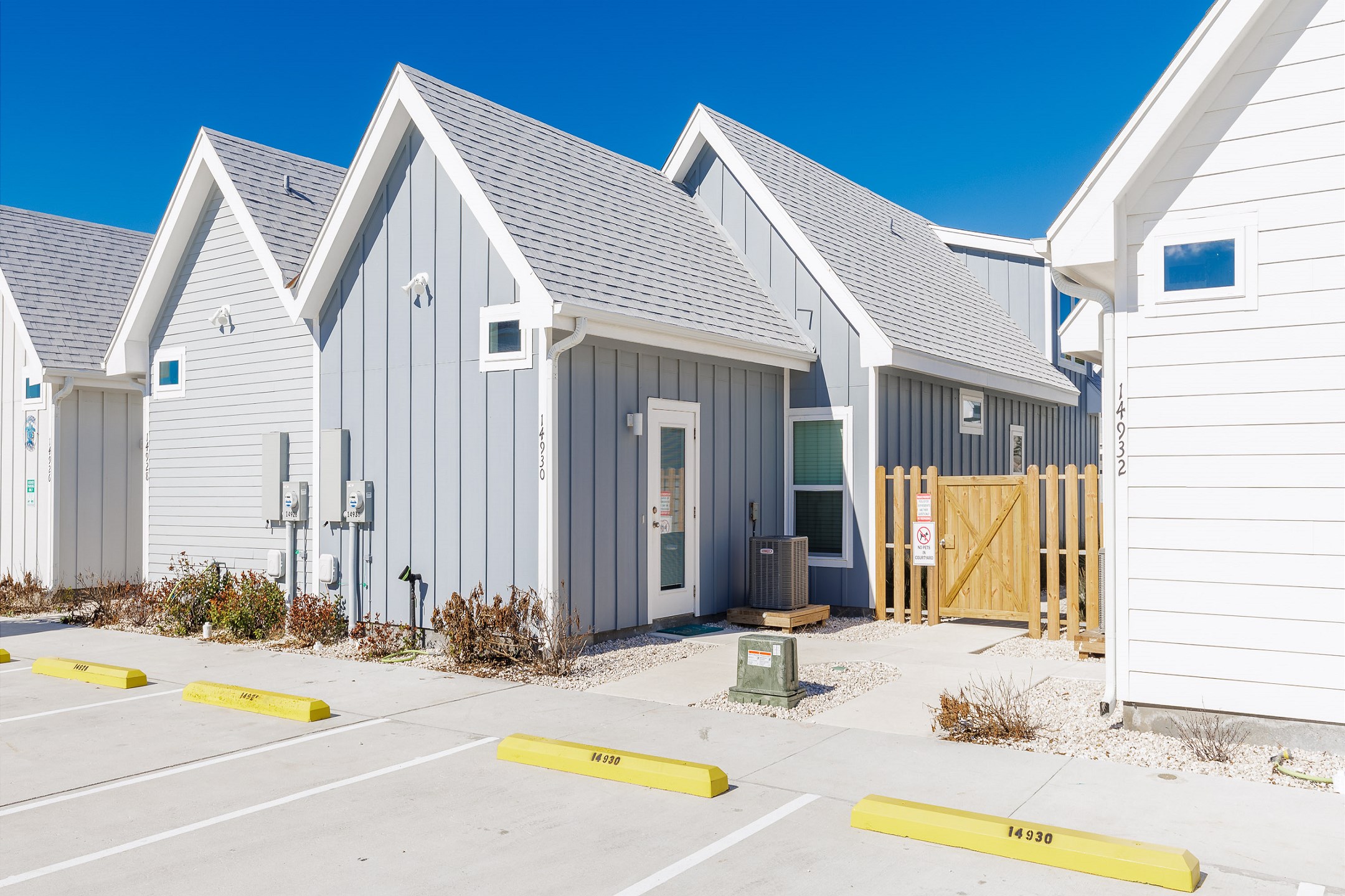 Exterior of property with two assigned parking spaces 