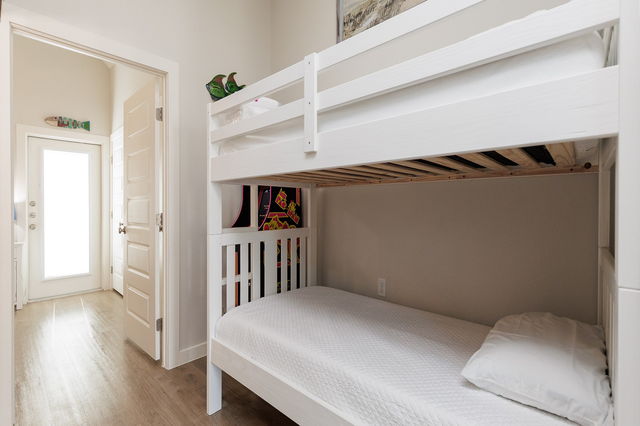 Twin over twin bunk beds in hallway nook 