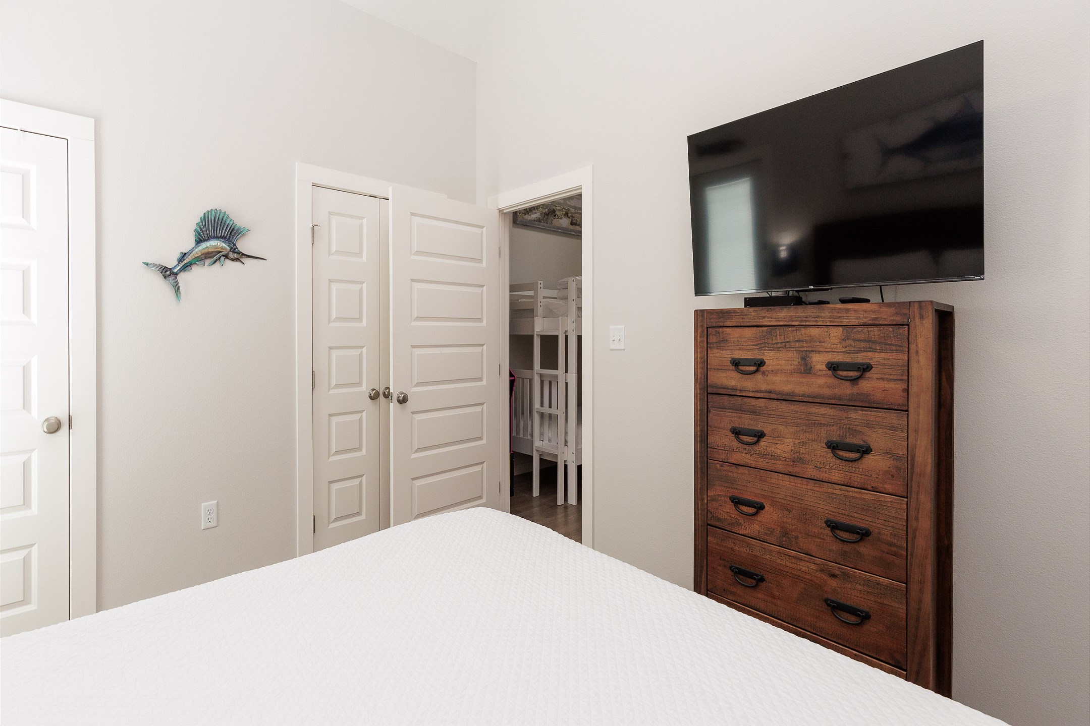 Master bedroom with king size bed and flat screen TV