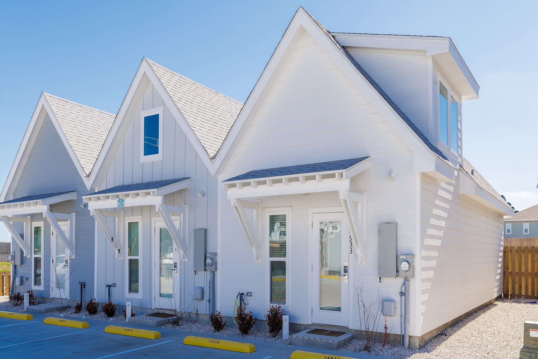 Exterior of property with two assigned parking spots 