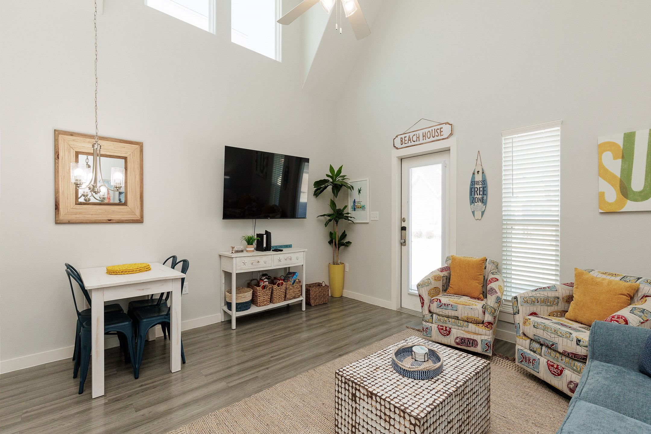 Living area with comfortable seating, queen size sleeper sofa, and flat screen TV 