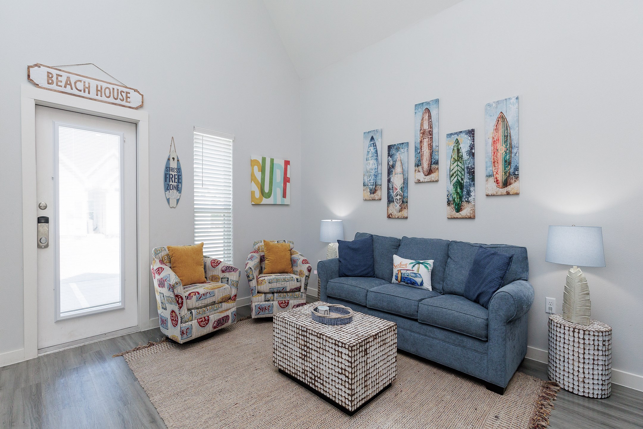 Living area with relaxed seating opening into front entryway 