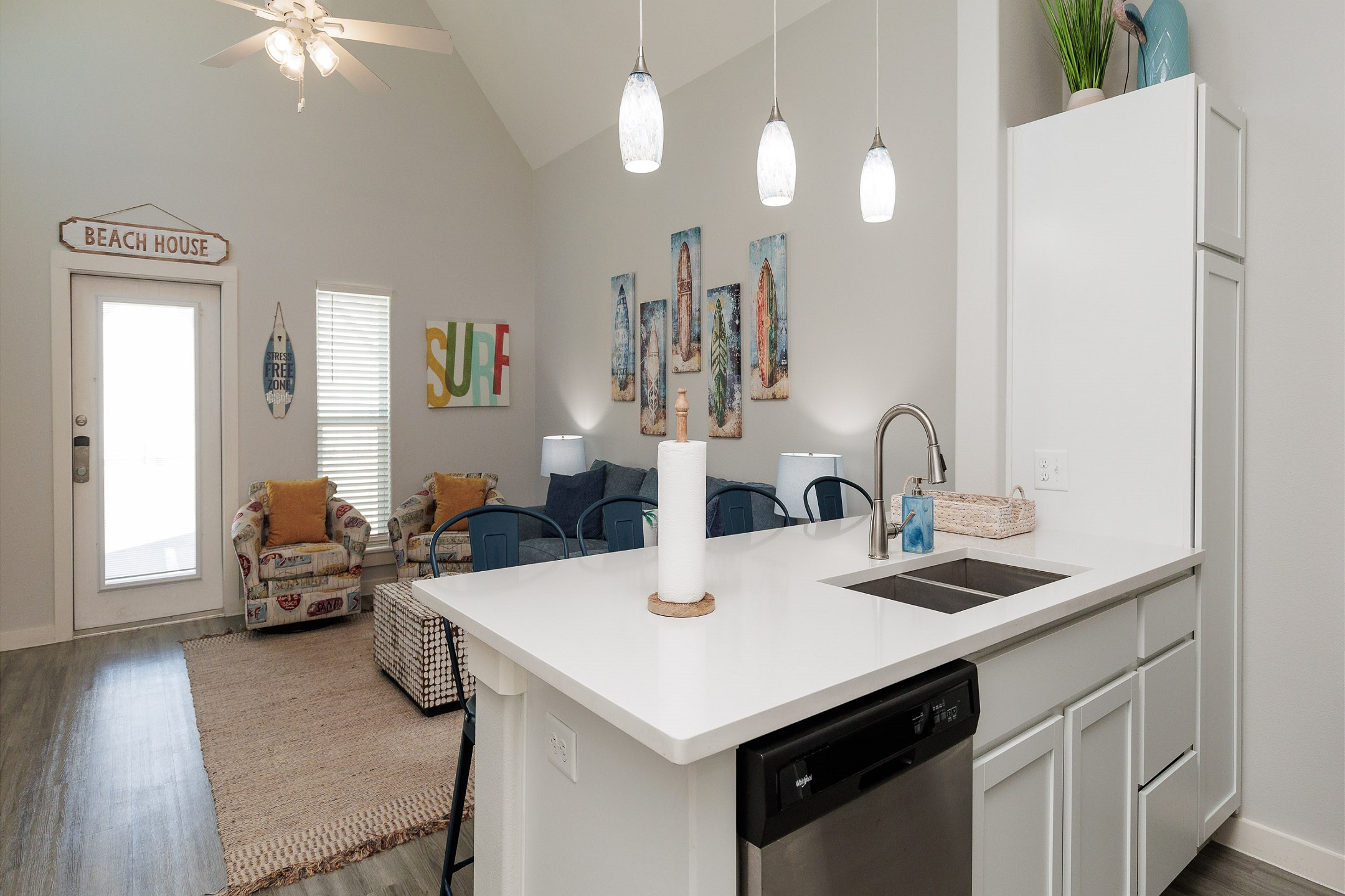 Open concept kitchen with granite countertops and opening into the living area 
