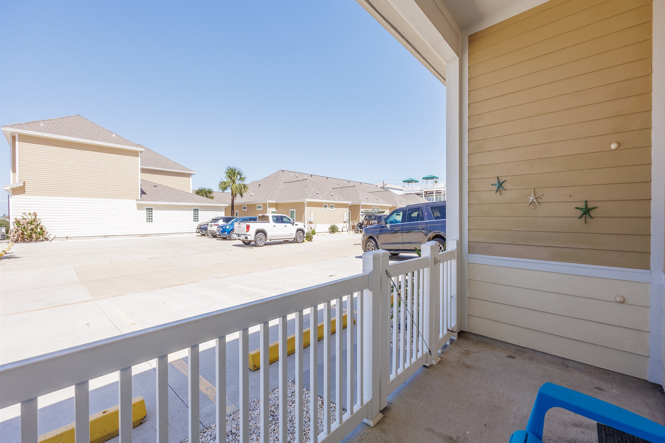 Private patio area with two reserved parking spaces in front of your townhome 