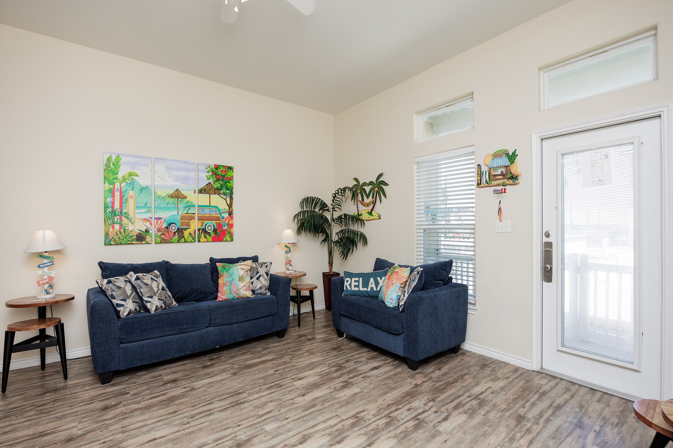 Spacious living area with full size sleeper sofa and bright light shinning in