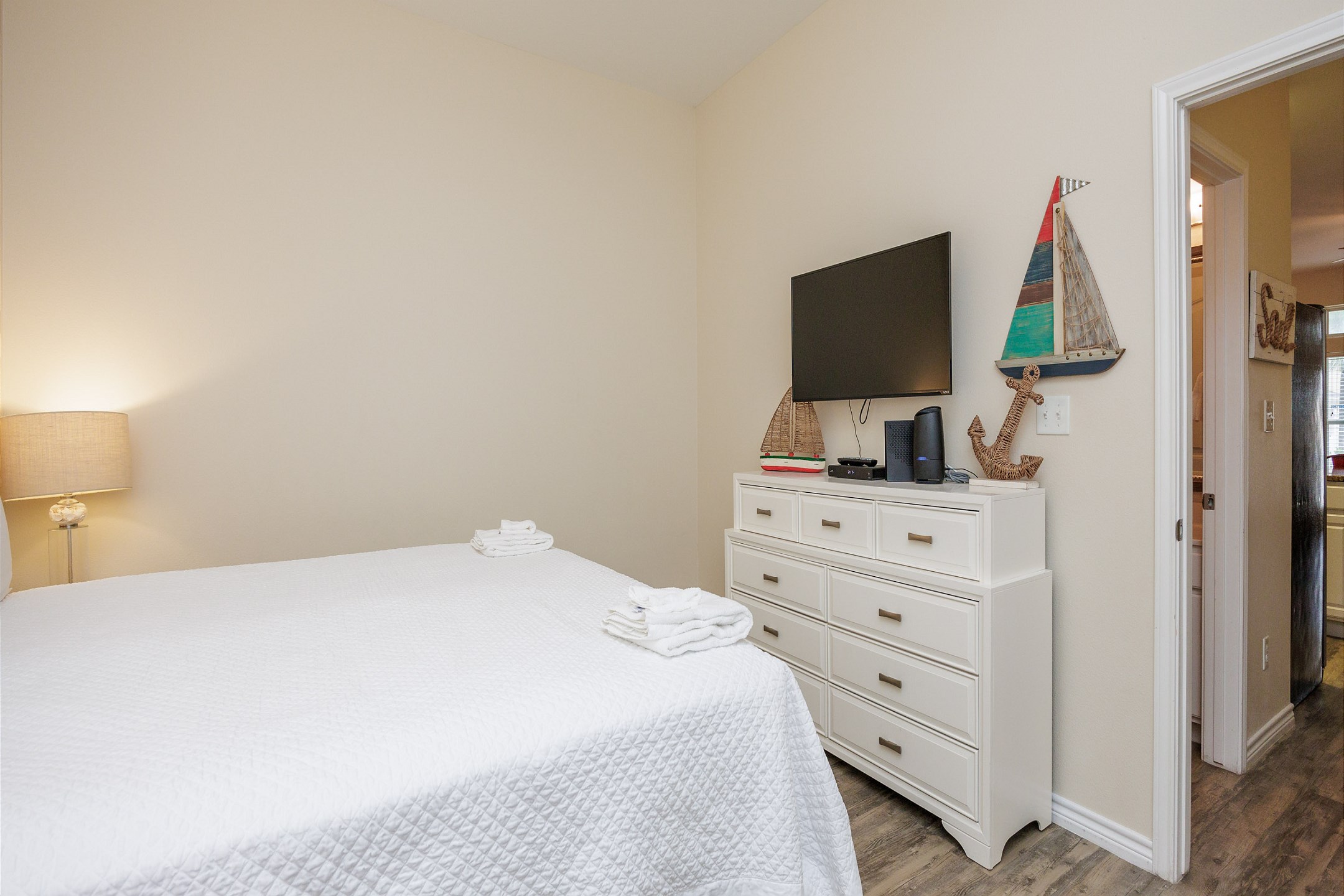 Master bedroom with king size bed and flat screen TV