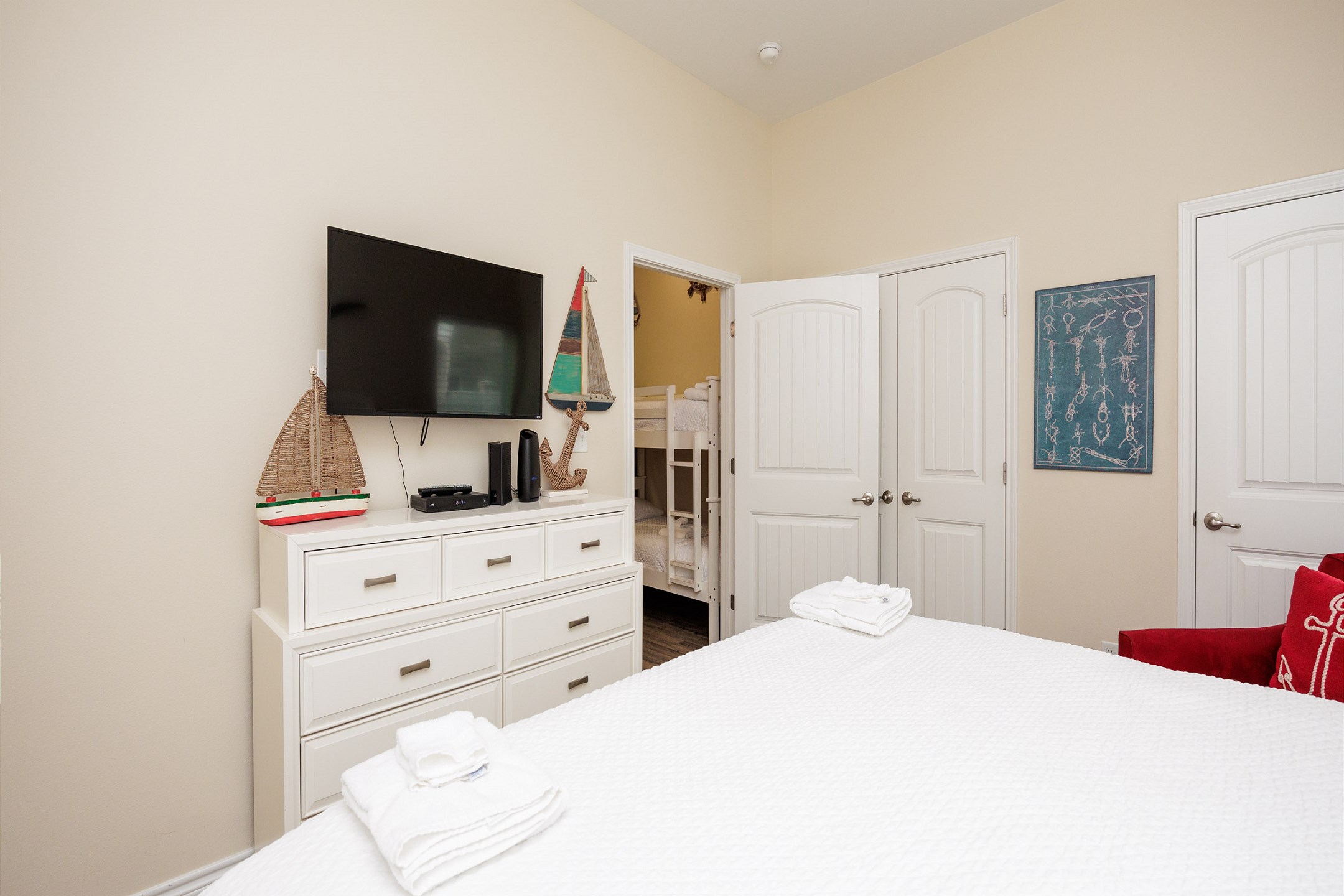 Master bedroom with king size bed and flat screen TV