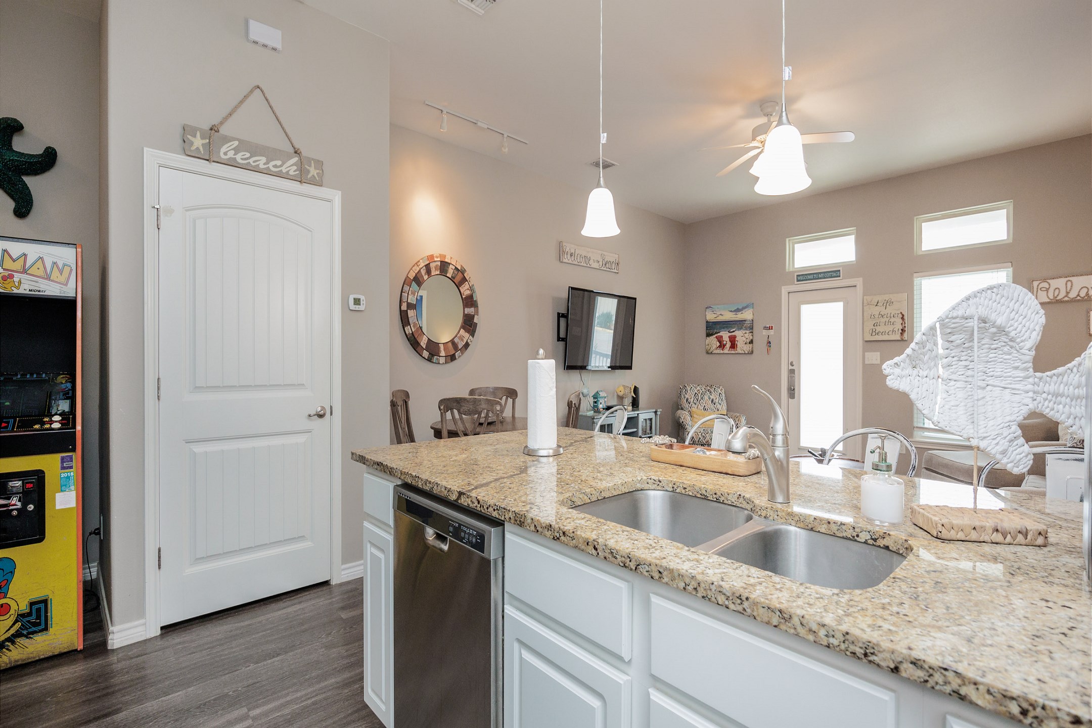Kitchen that comes with cookware, utensils, and dinnerware for guest use