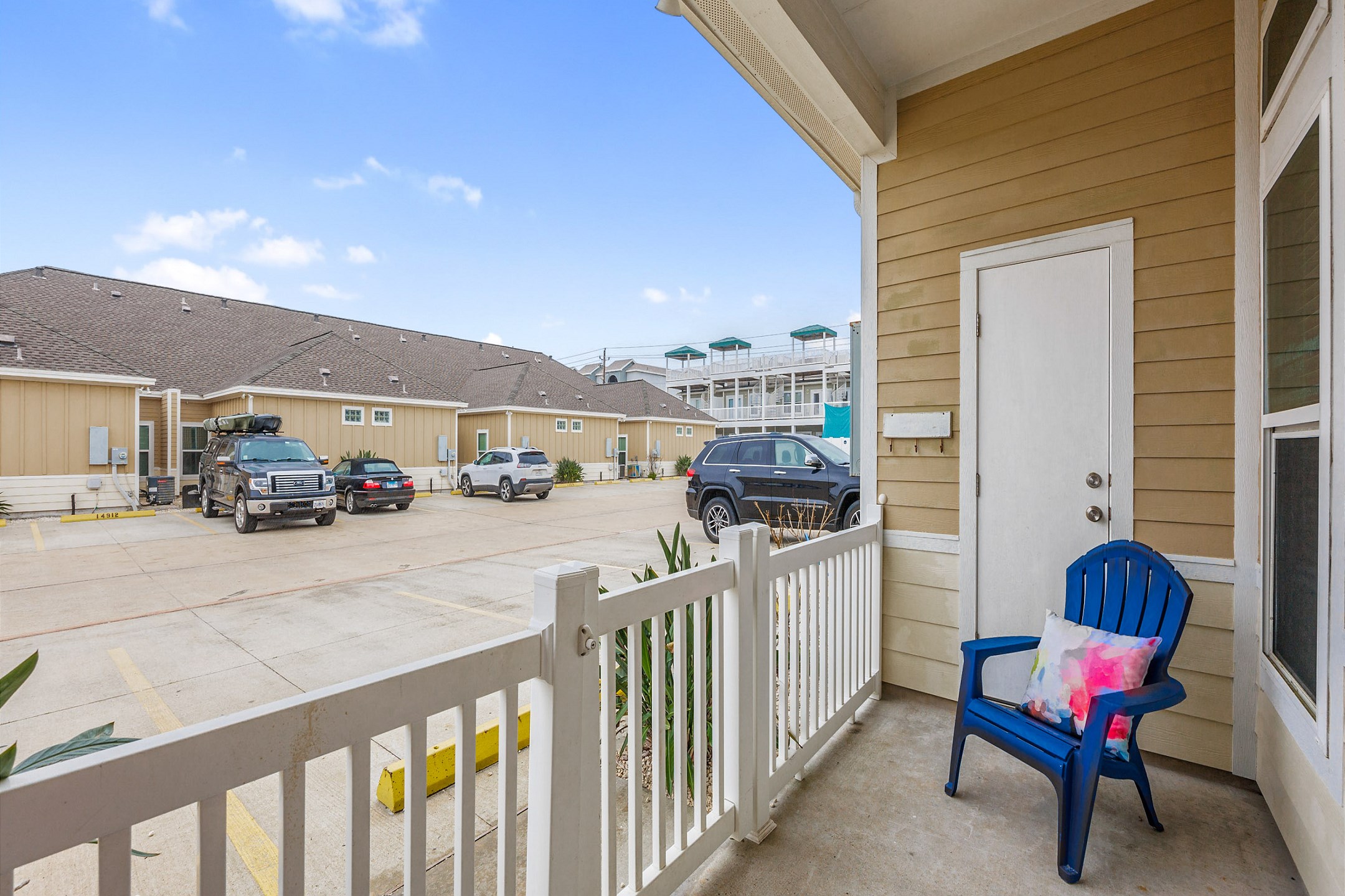 Private patio space with two reserved parking spots directly in front