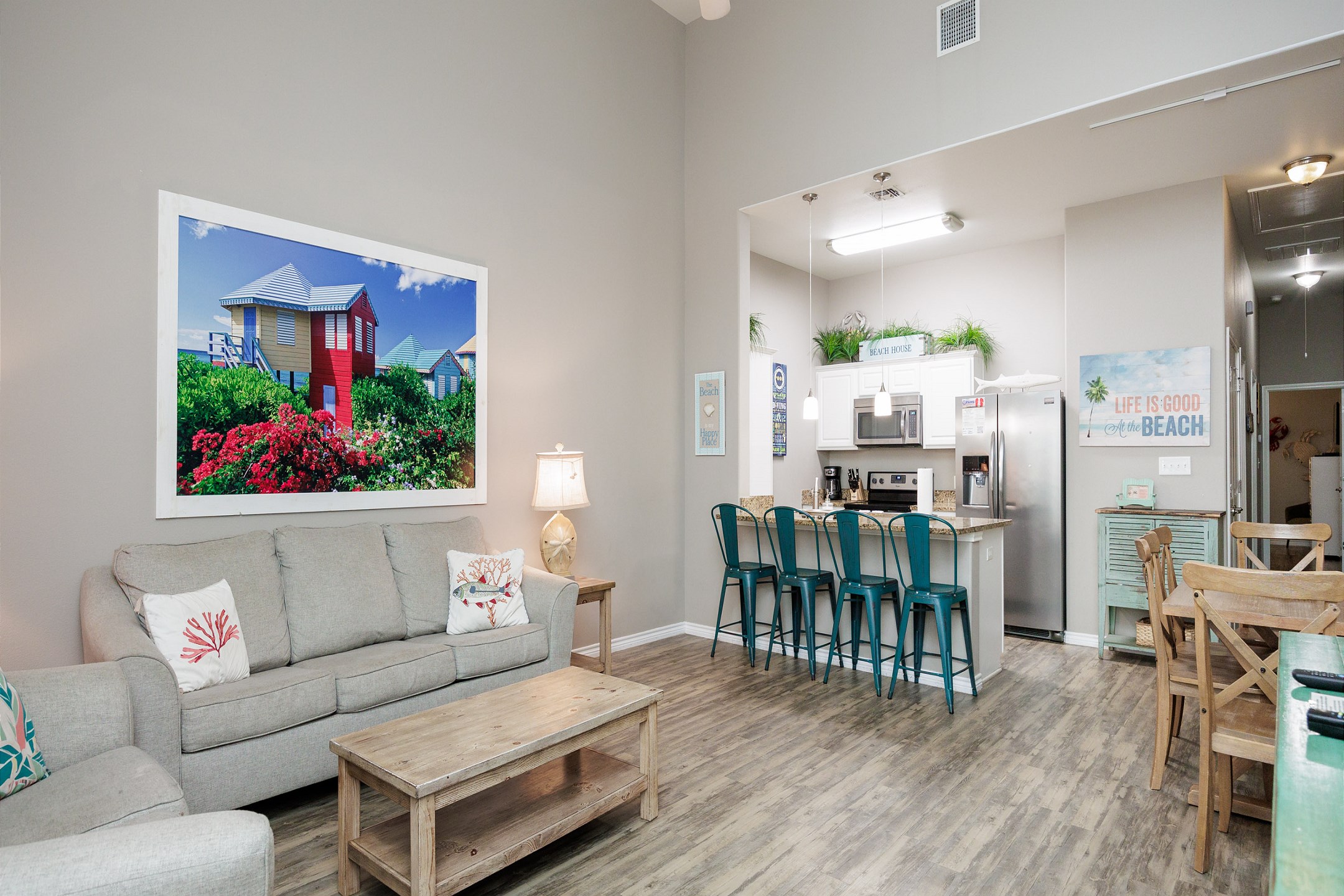 Open-concept living area with high ceilings, flooded with natural light and providing the perfect ambiance for unwinding after a day of adventures