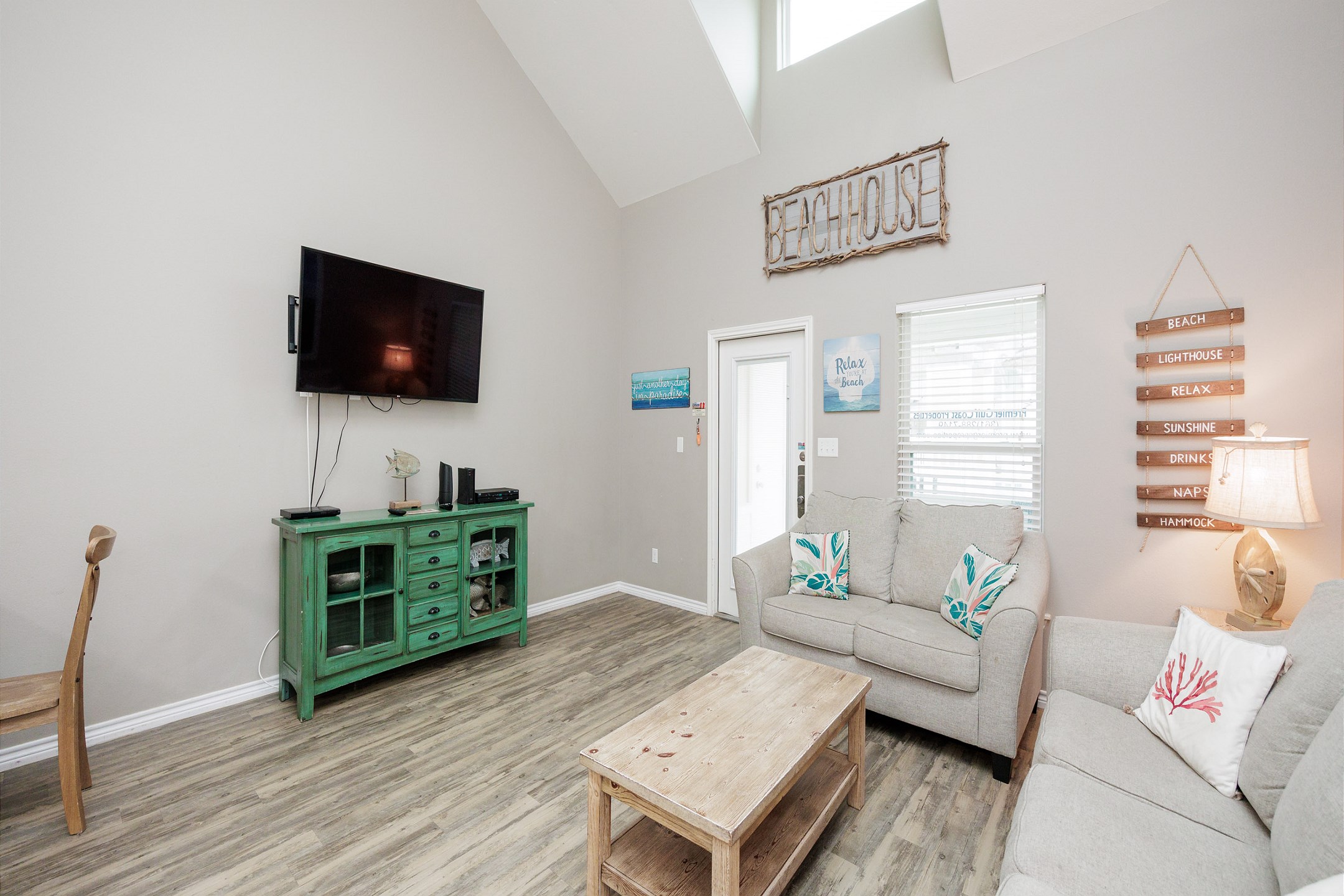 Modern entertainment haven boasting a state-of-the-art flat-screen TV & comfortable lounging options for movie nights