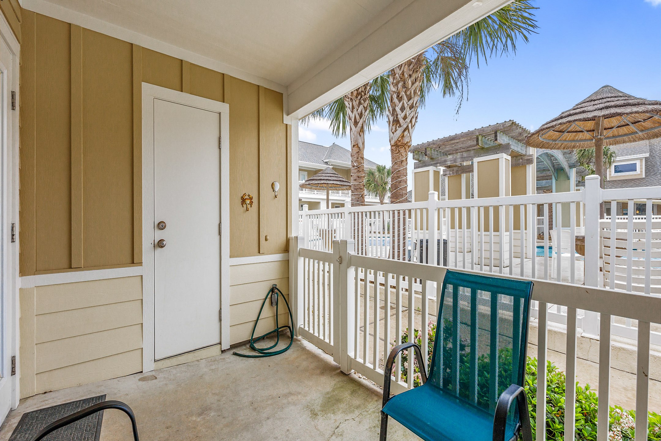 Private patio with a pool view