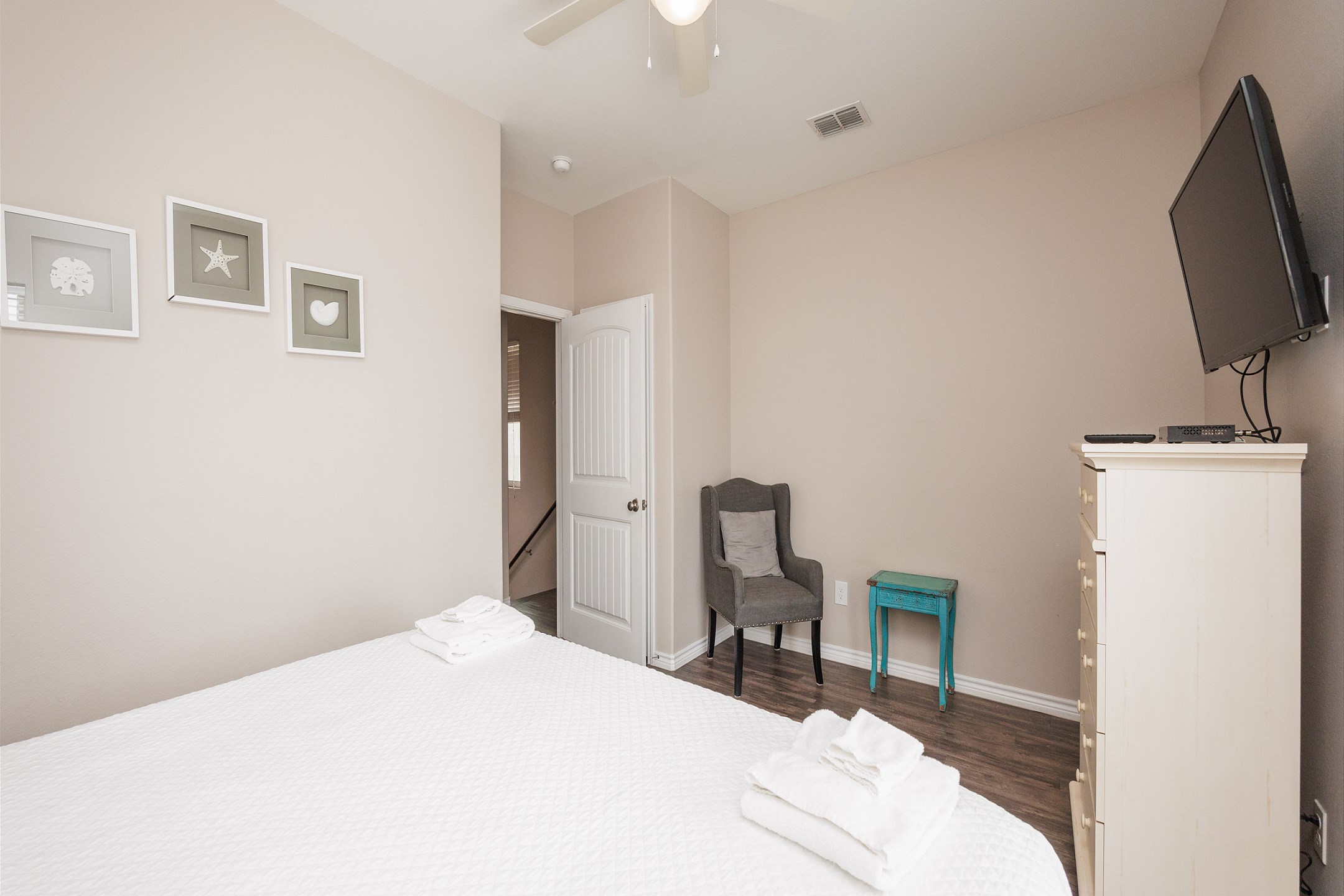 Third bedroom on the second floor with king size bed, access to private balcony, and flat screen TV