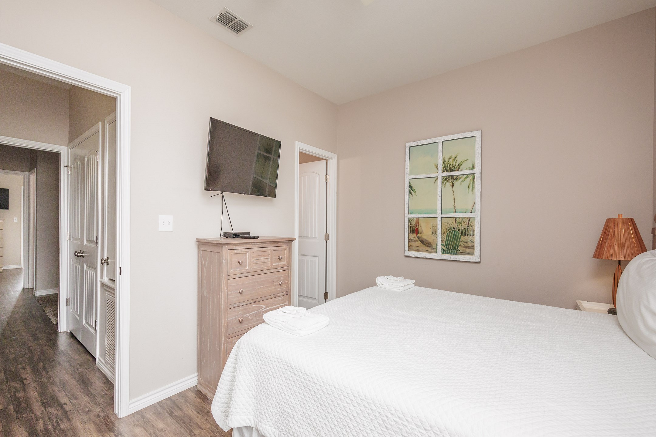 Second bedroom on the second floor with king size bed, private bathroom and flat screen TV 