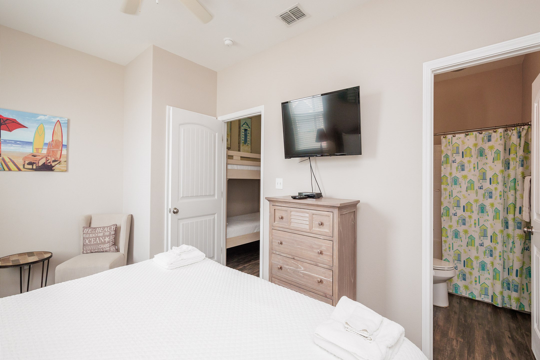 Second bedroom on the second floor with king size bed, private bathroom and flat screen TV 