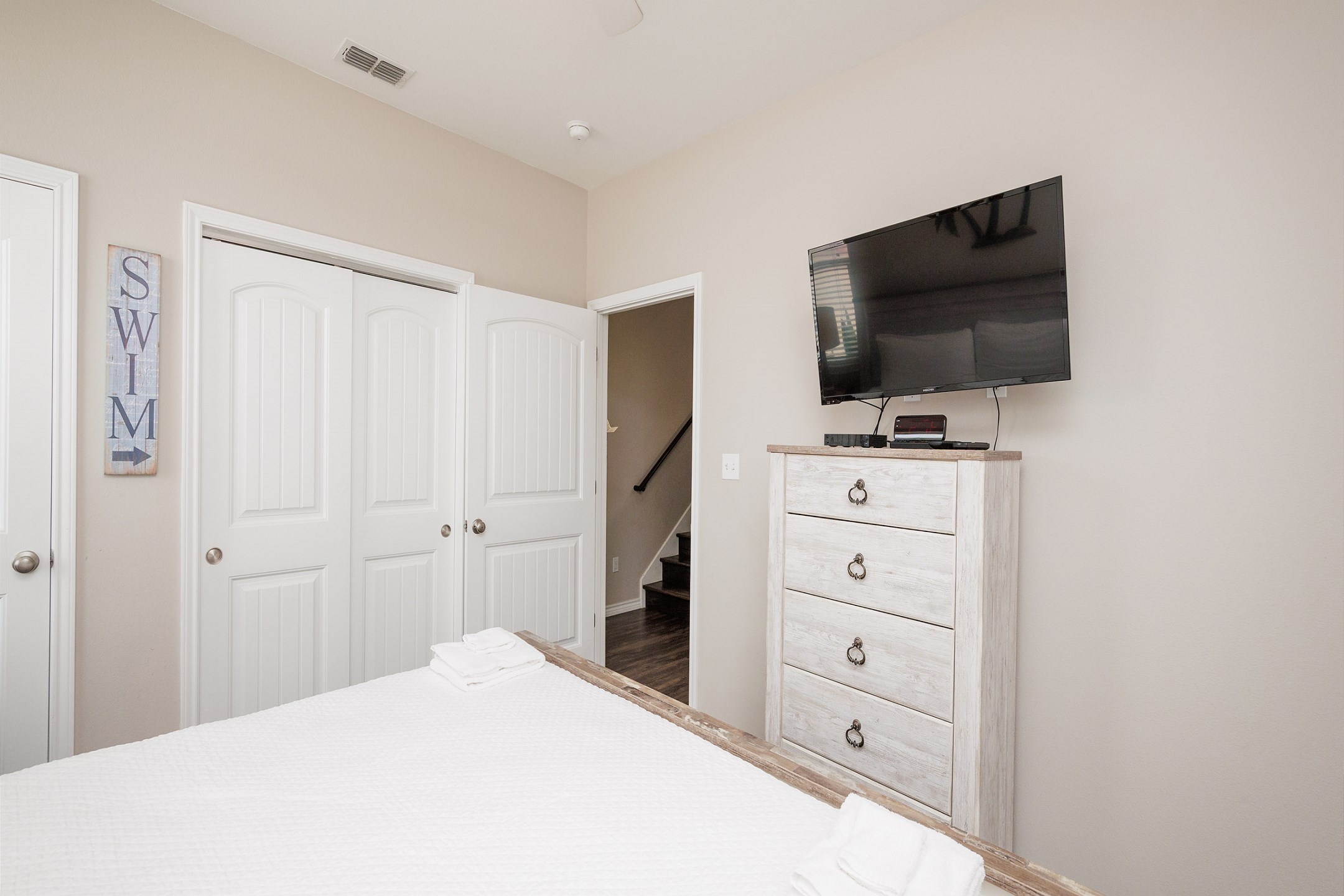Master bedroom on the first floor with king size bed and flat screen TV 