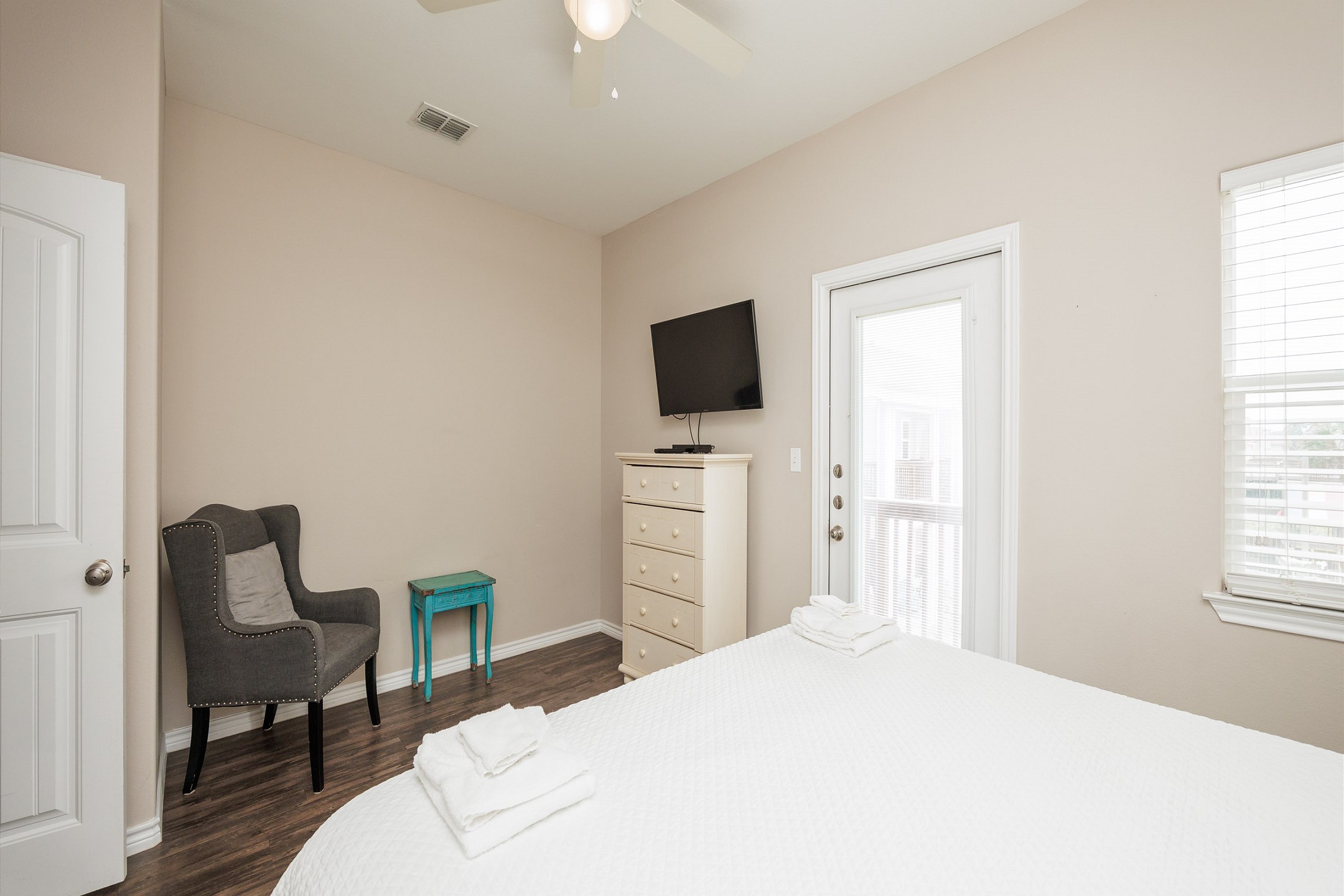 Third bedroom on the second floor with king size bed, private balcony, and flat screen TV