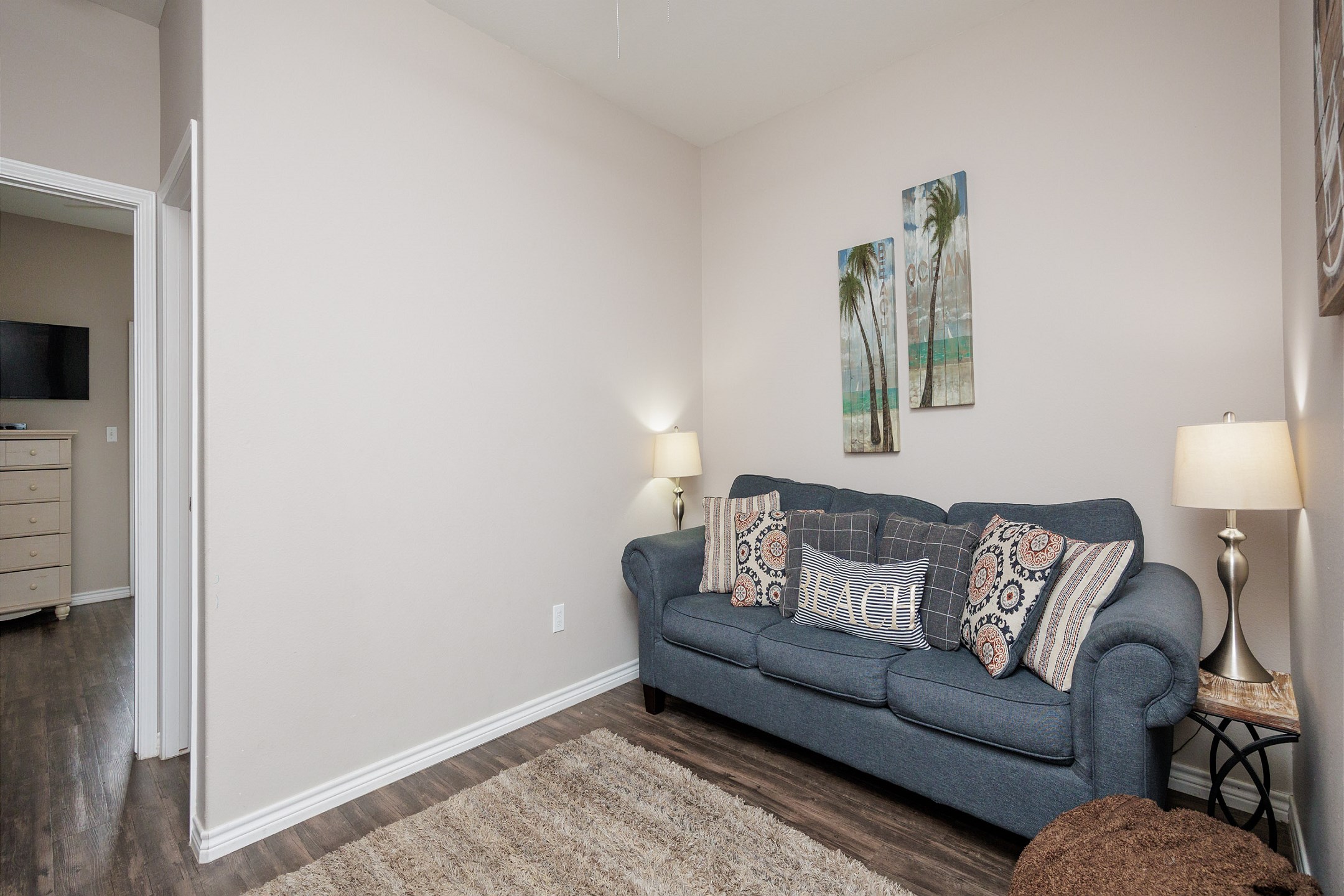 Media room on the second floor with cozy sofa