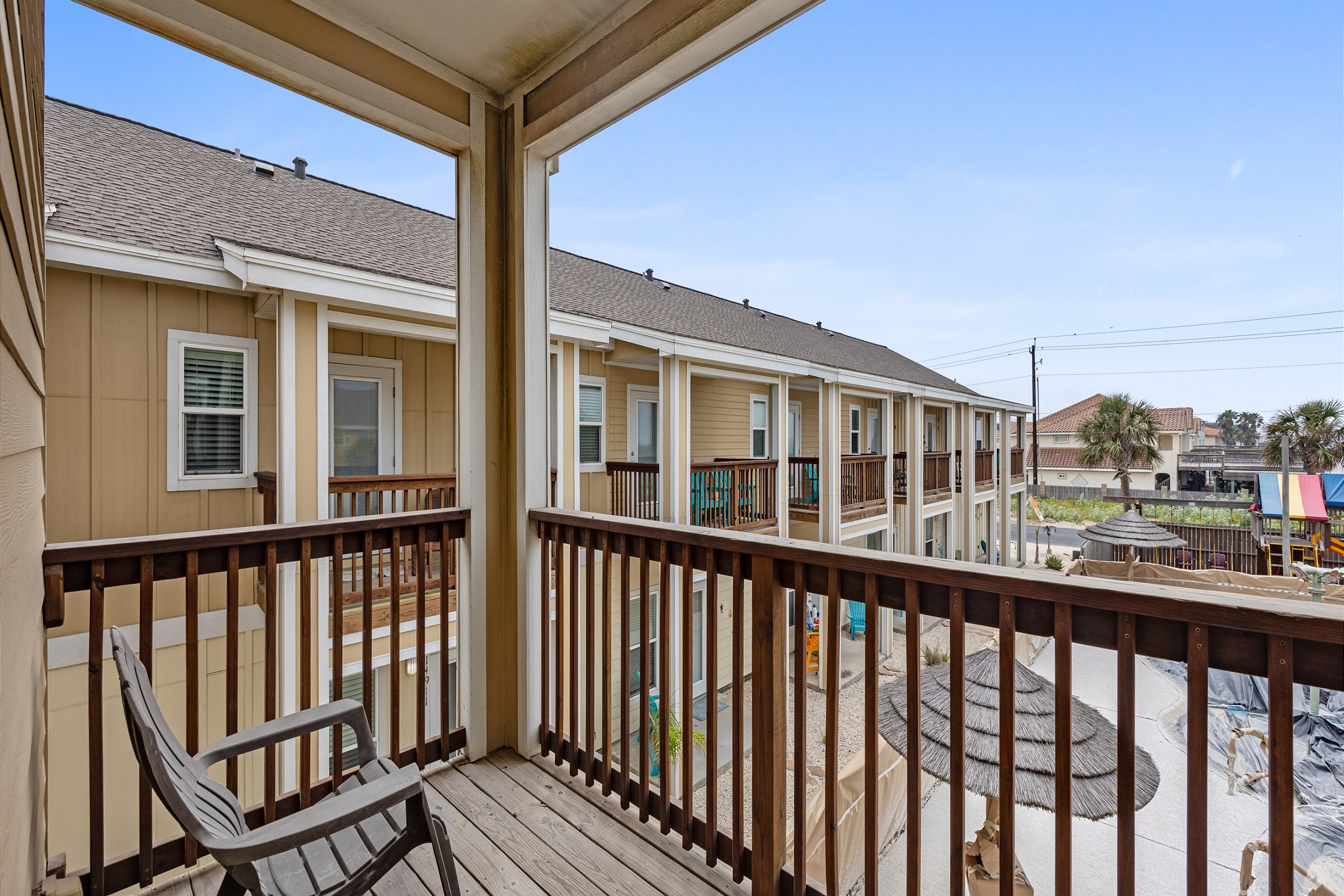 Private balcony attached to third bedroom with a pool view
