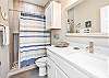 Guest bathroom on the second floor attached to the third guest bedroom with walk-in shower