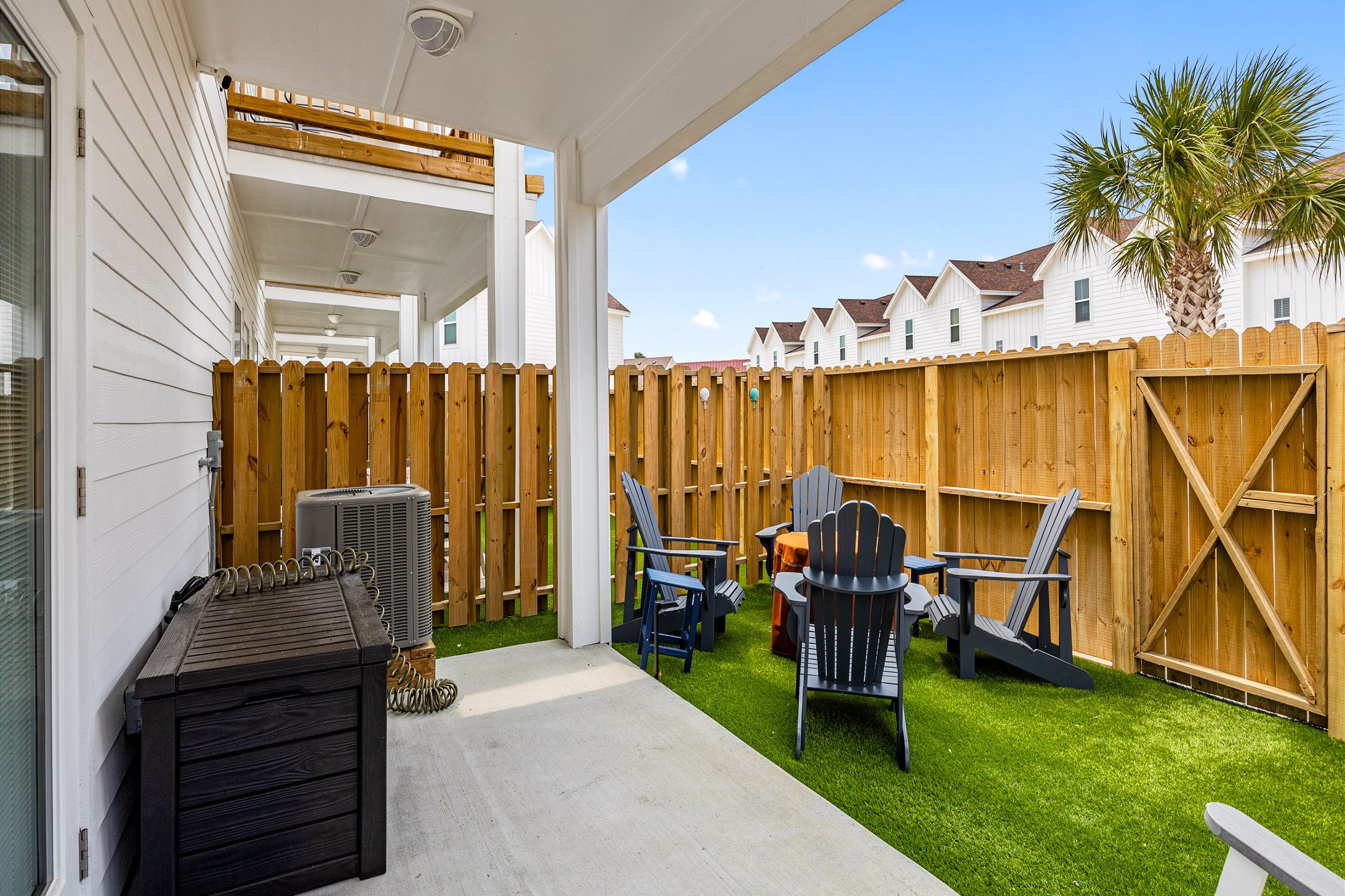 Step out onto your private patio with lush turf and plenty of seating—perfect for laid-back lounging, sunset cocktails, or entertaining under the stars.